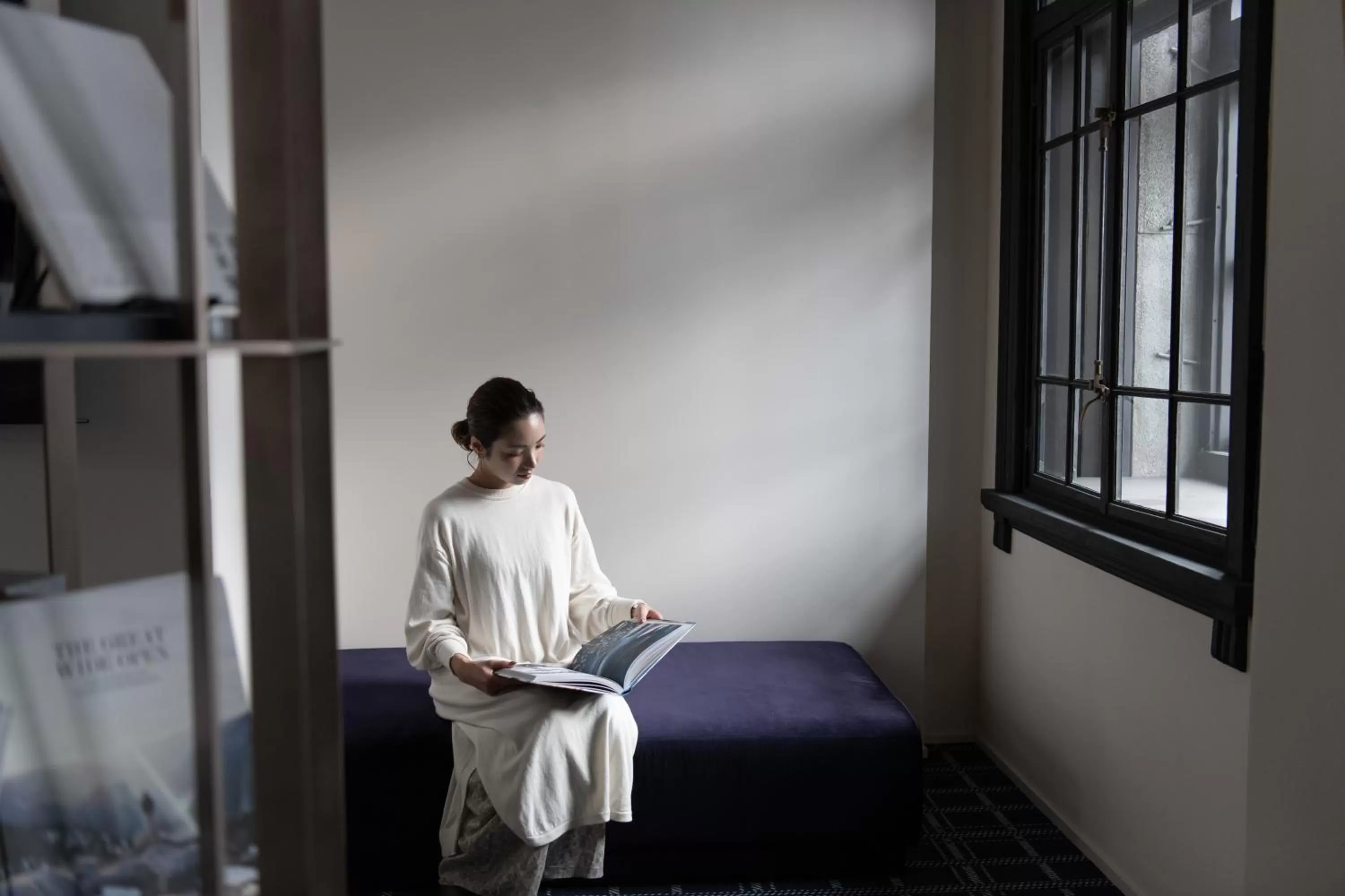 Communal lounge/ TV room in HakoBA Hakodate by THE SHARE HOTELS