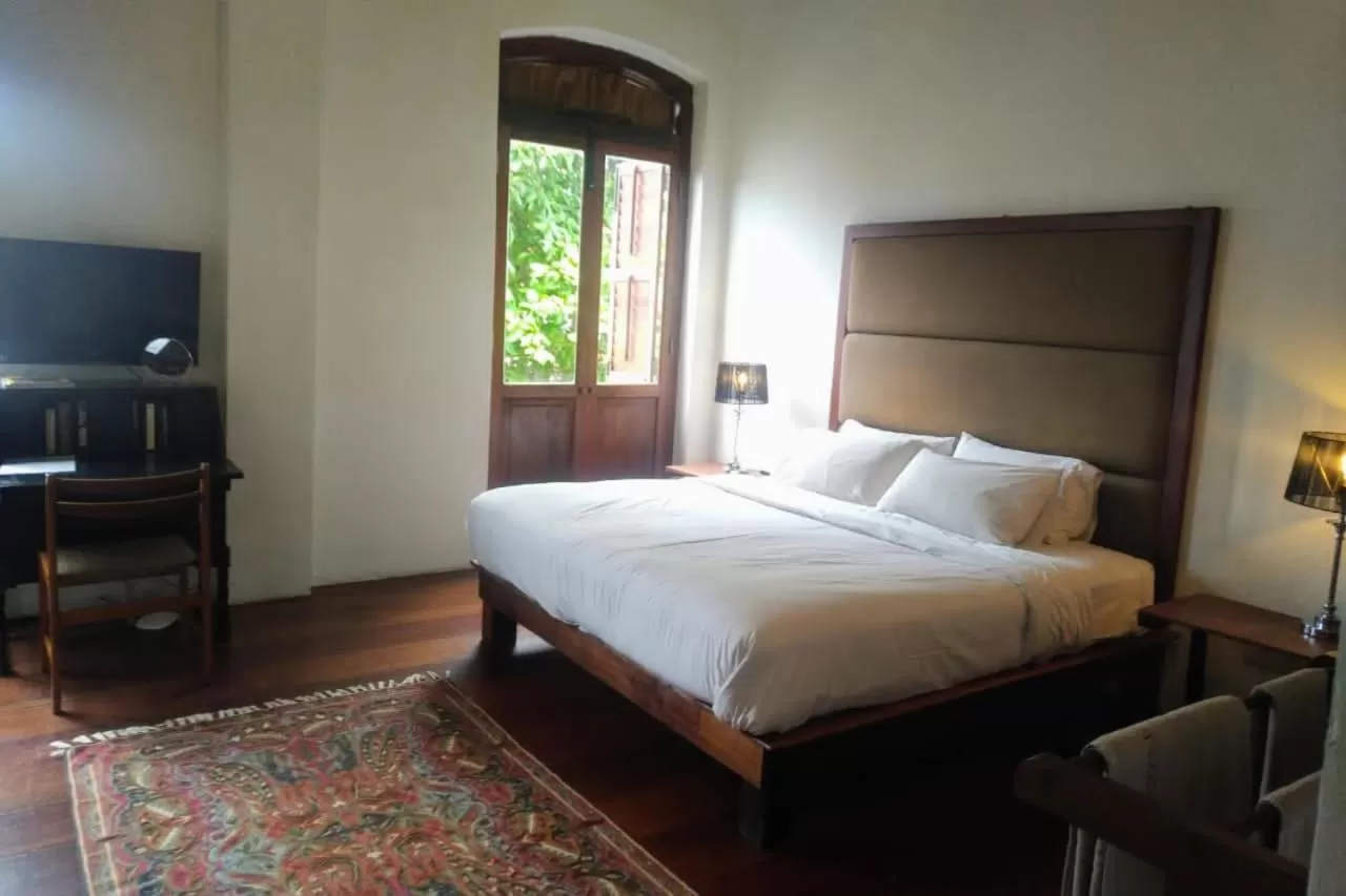 Bed in Ren I Tang Heritage Inn