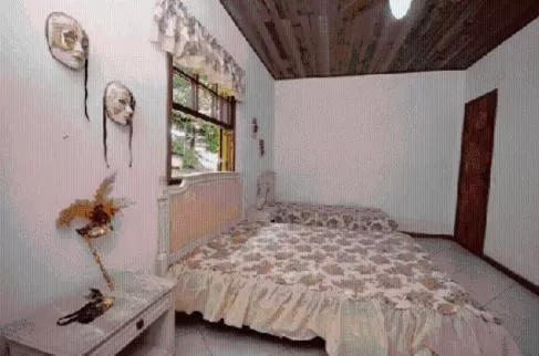 Bed in Pousada A Marca do Faraó