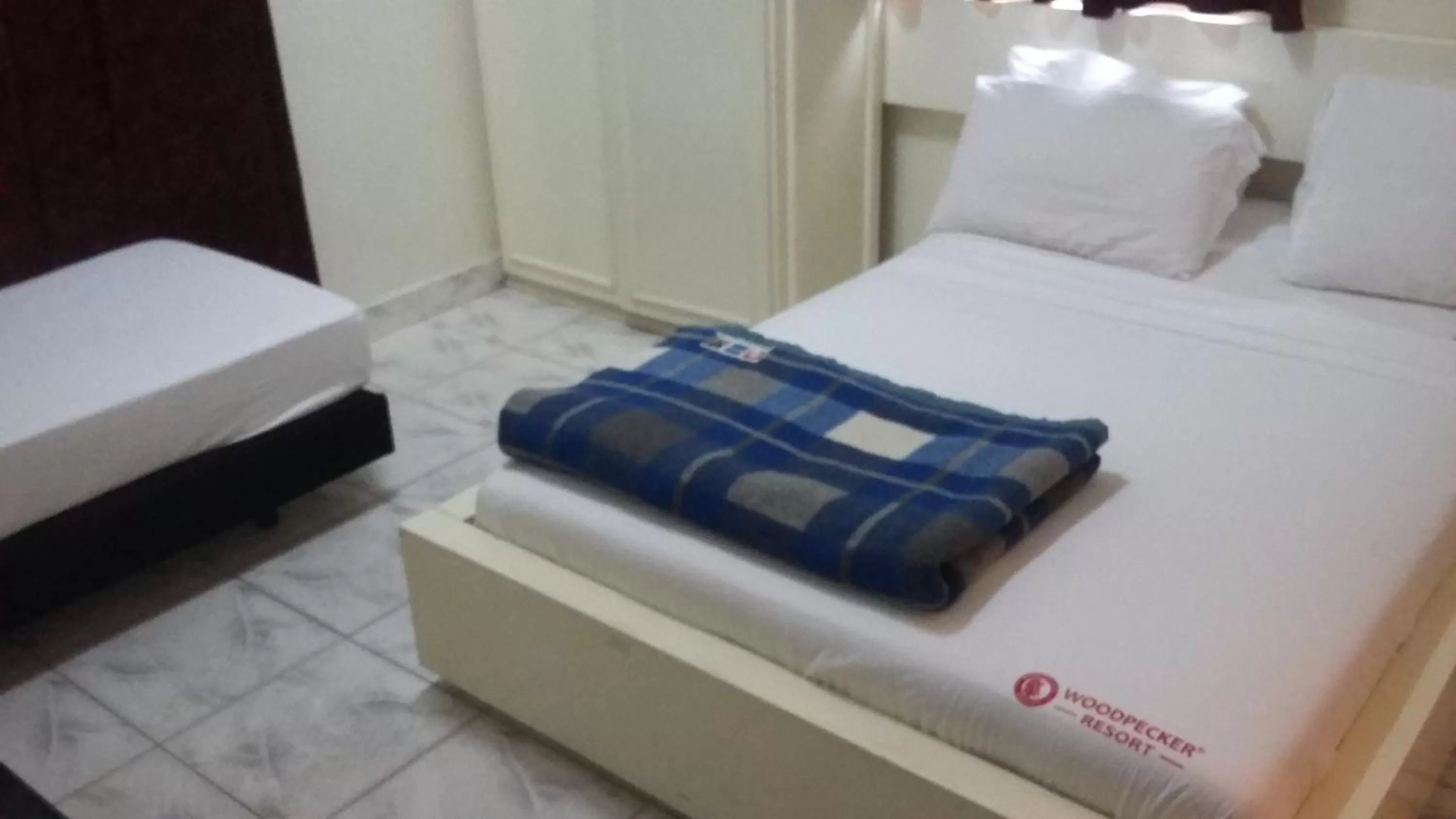 Bed in Woodpecker Resort Hotel