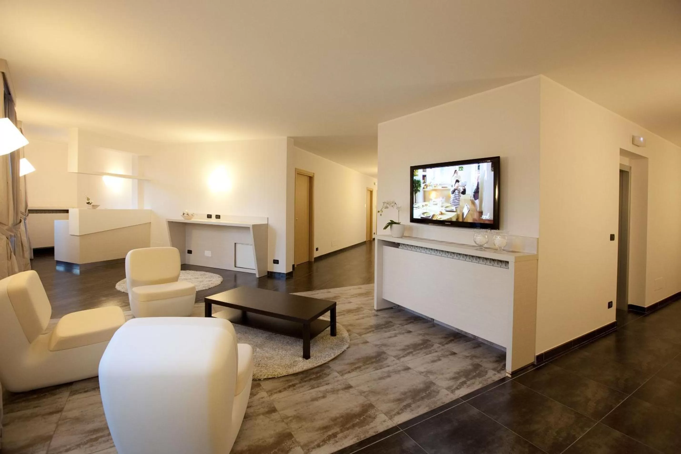 Communal lounge/ TV room in Hotel La Meridiana