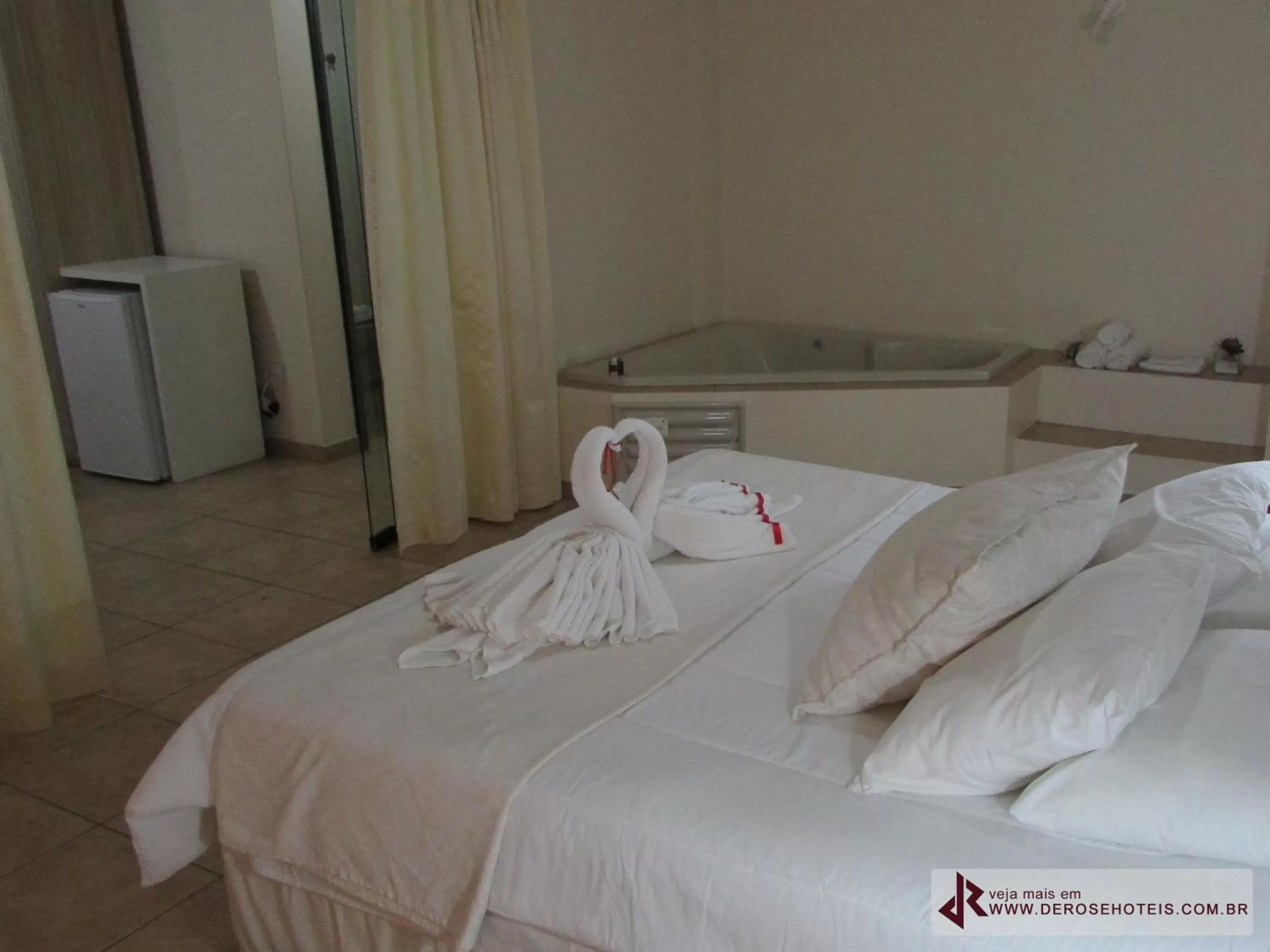 Bed in De Rose Palace Hotel