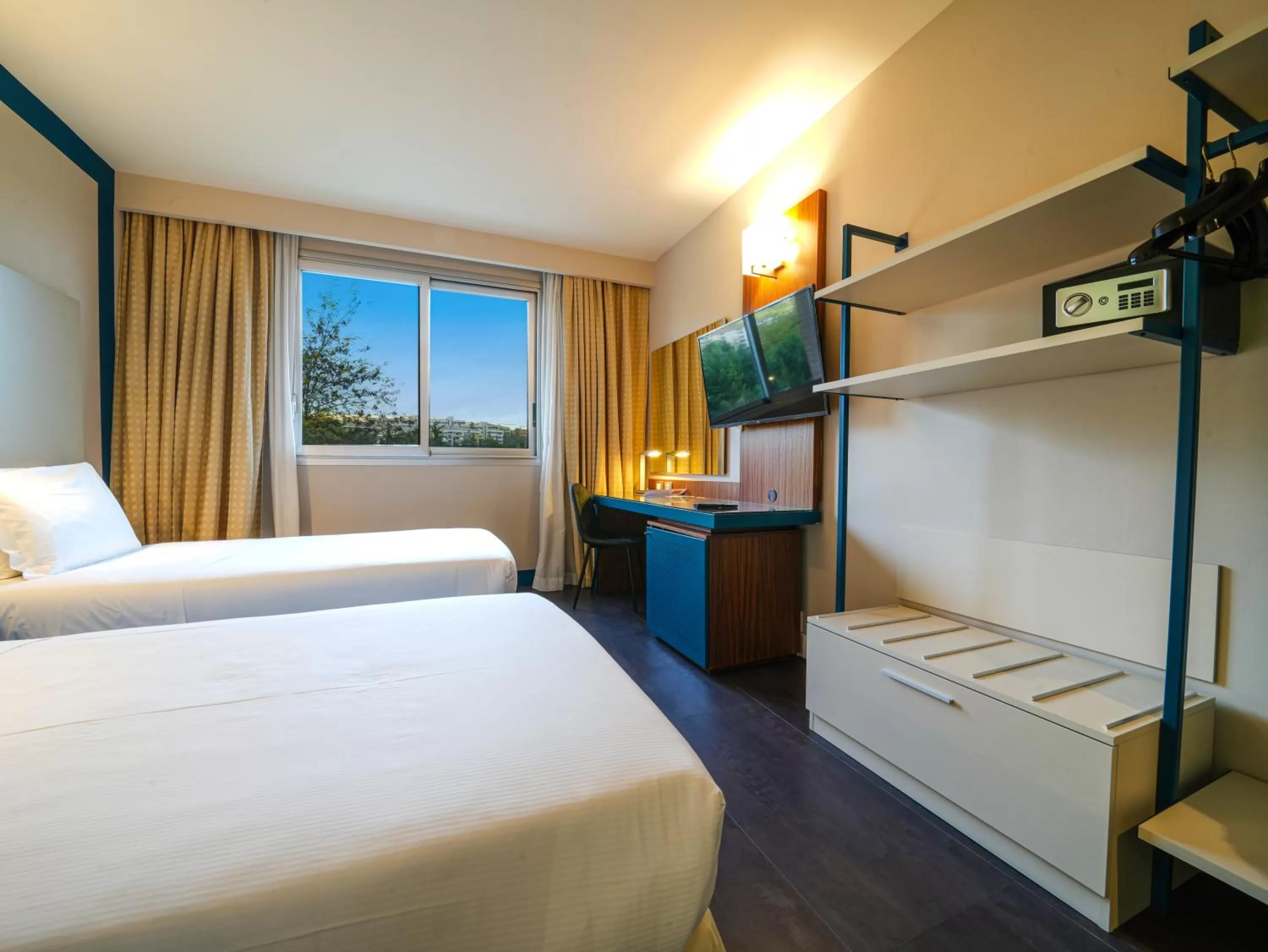 Bed in La Meridiana Bleisure Hotel