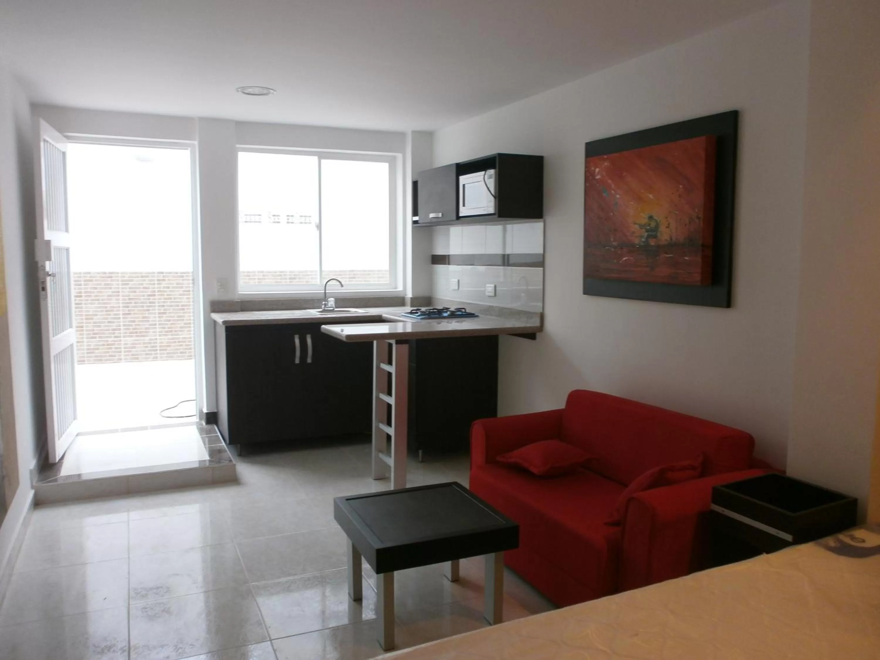 Living room, Kitchen/Kitchenette in Villa San Miguel