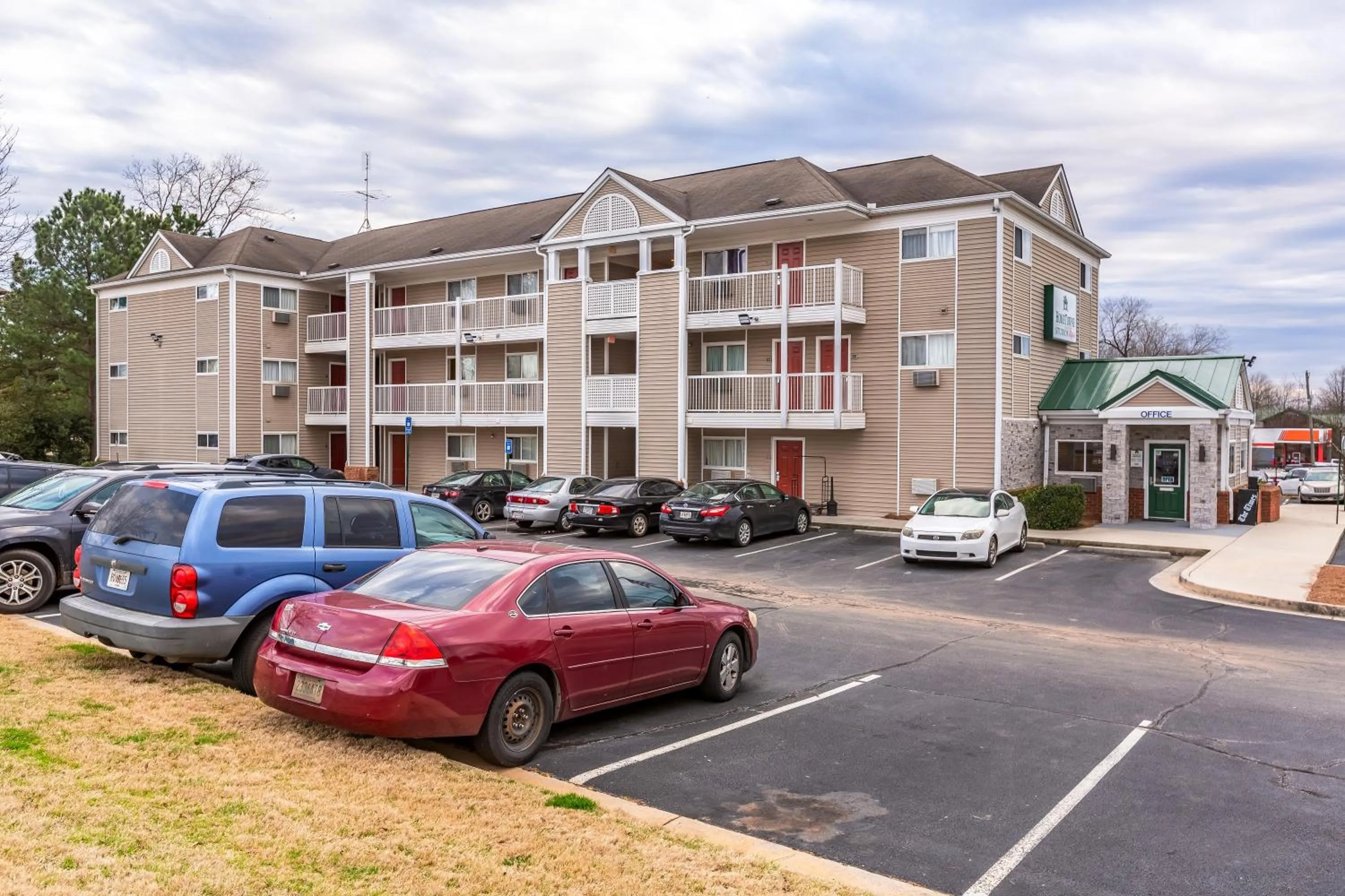 Property building in HomeTowne Studios by Red Roof Gainesville, GA