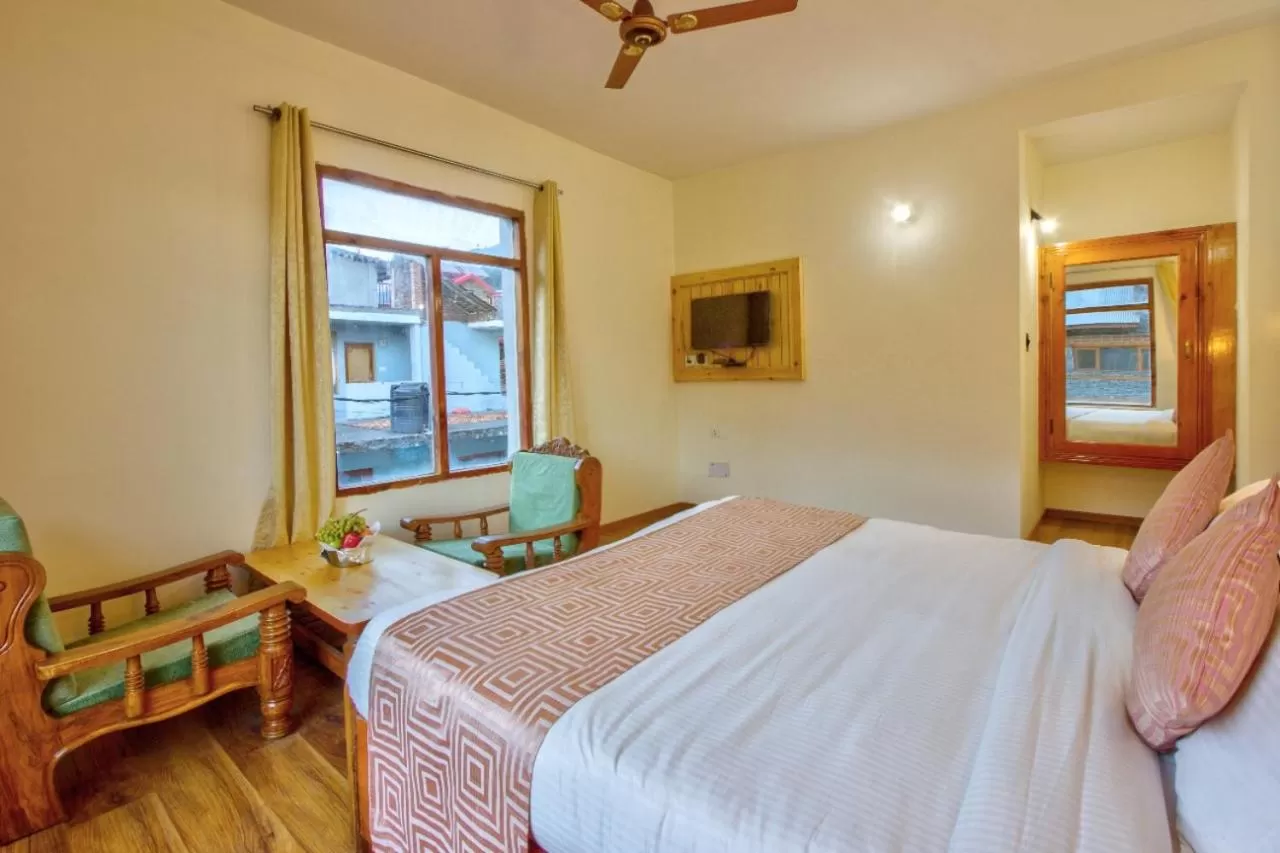 Bed in Ayushman Hotels