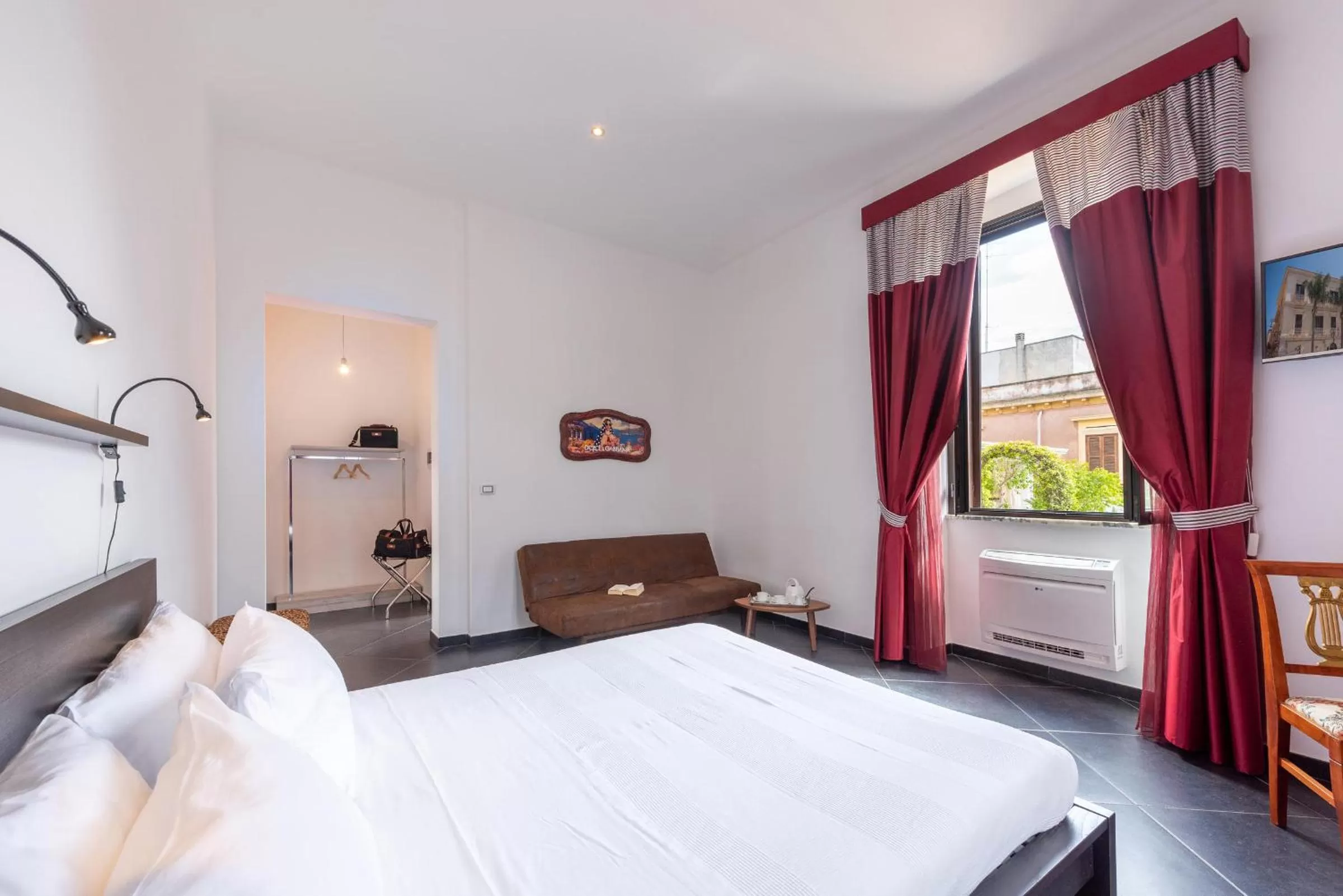 Bed in Maria Vittoria Charming Rooms and Apartments