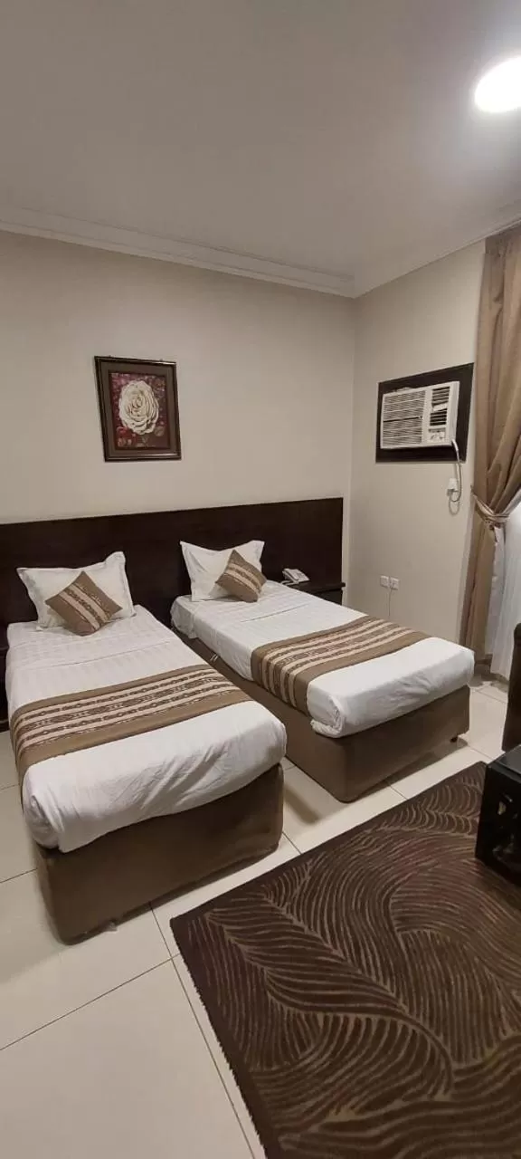 Bed in Shams Suites Furnished Units