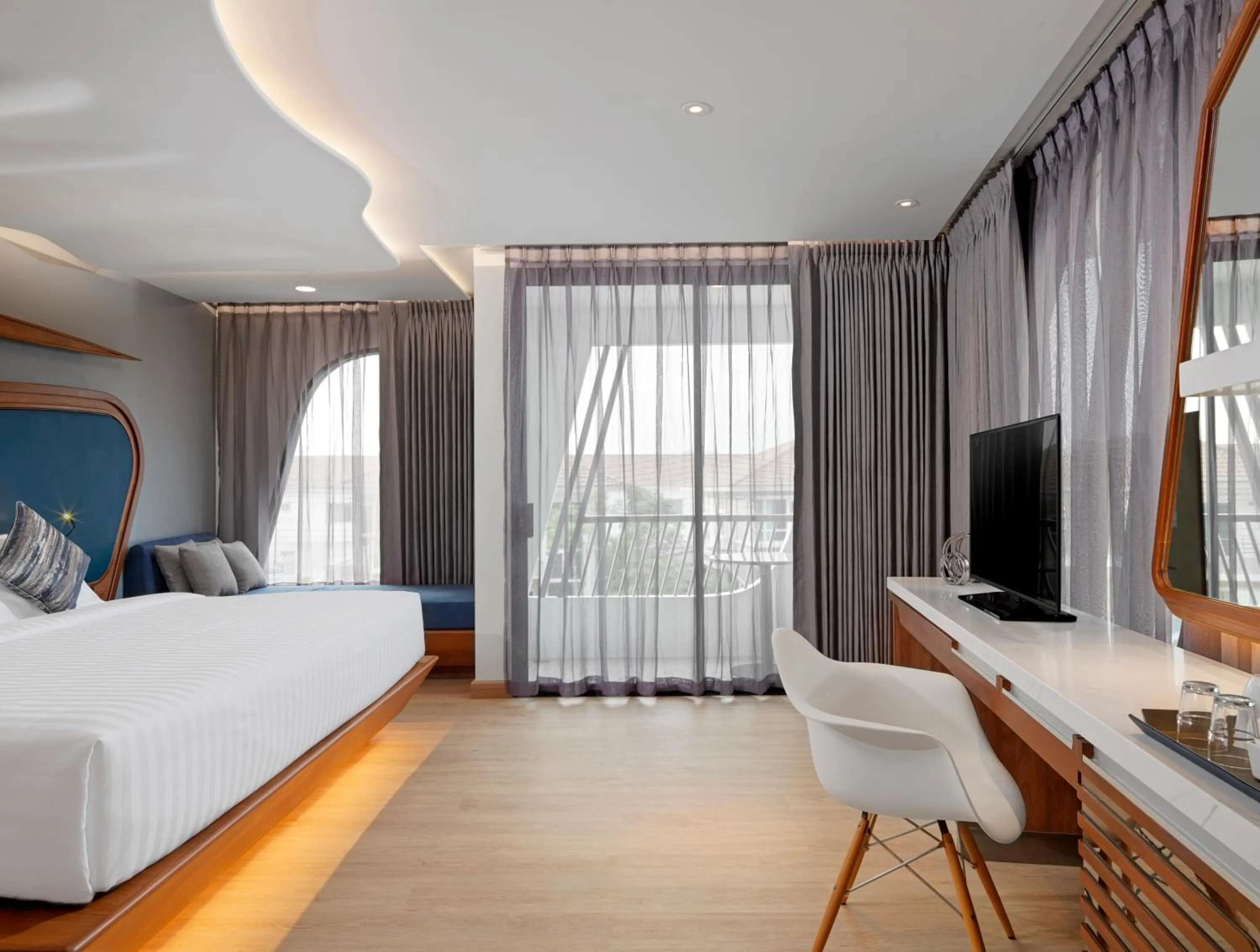 Photo of the whole room, Bed in The Oceanic Sportel Phuket - SHA Extra Plus