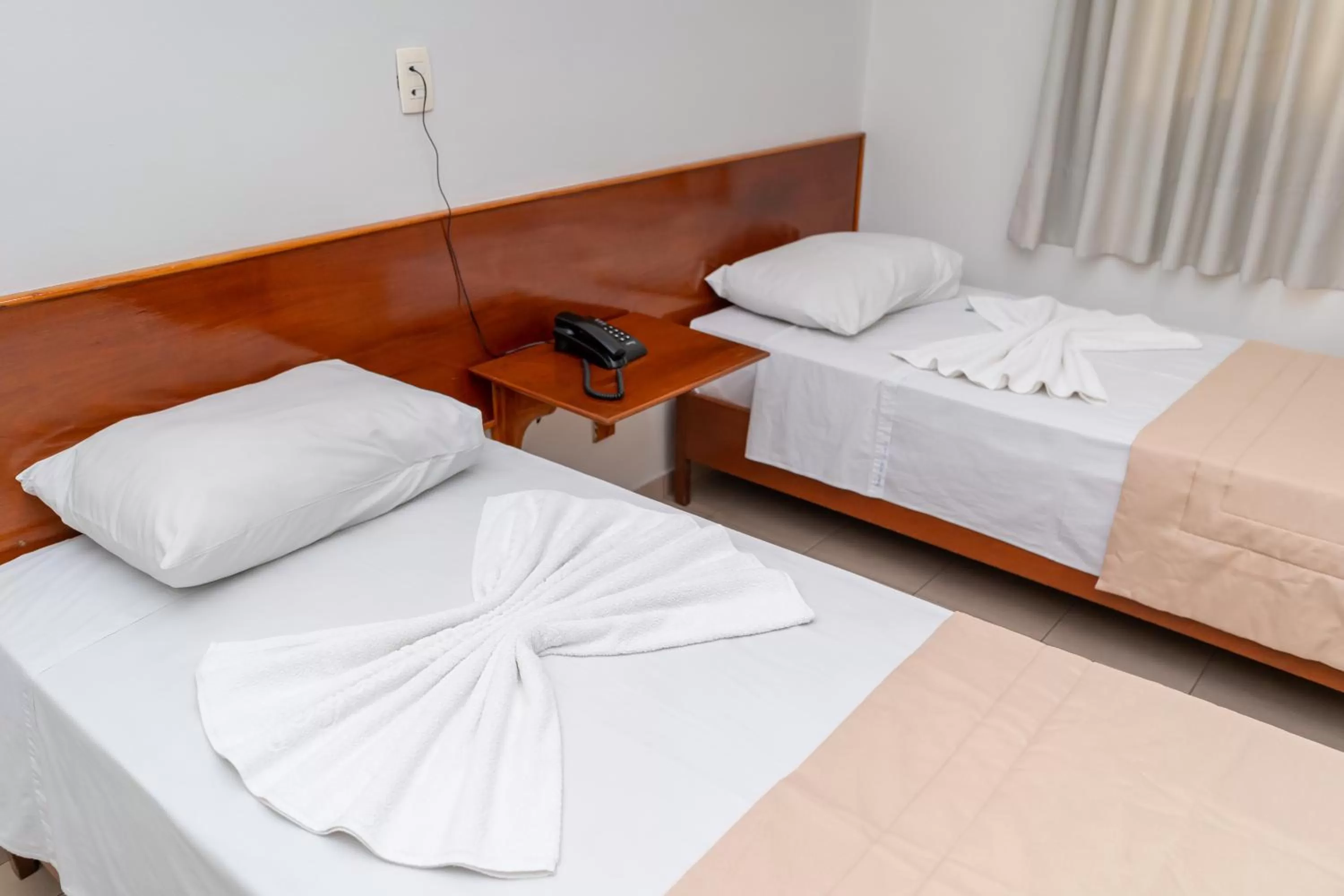 Bed in Bandeirantes Hotel