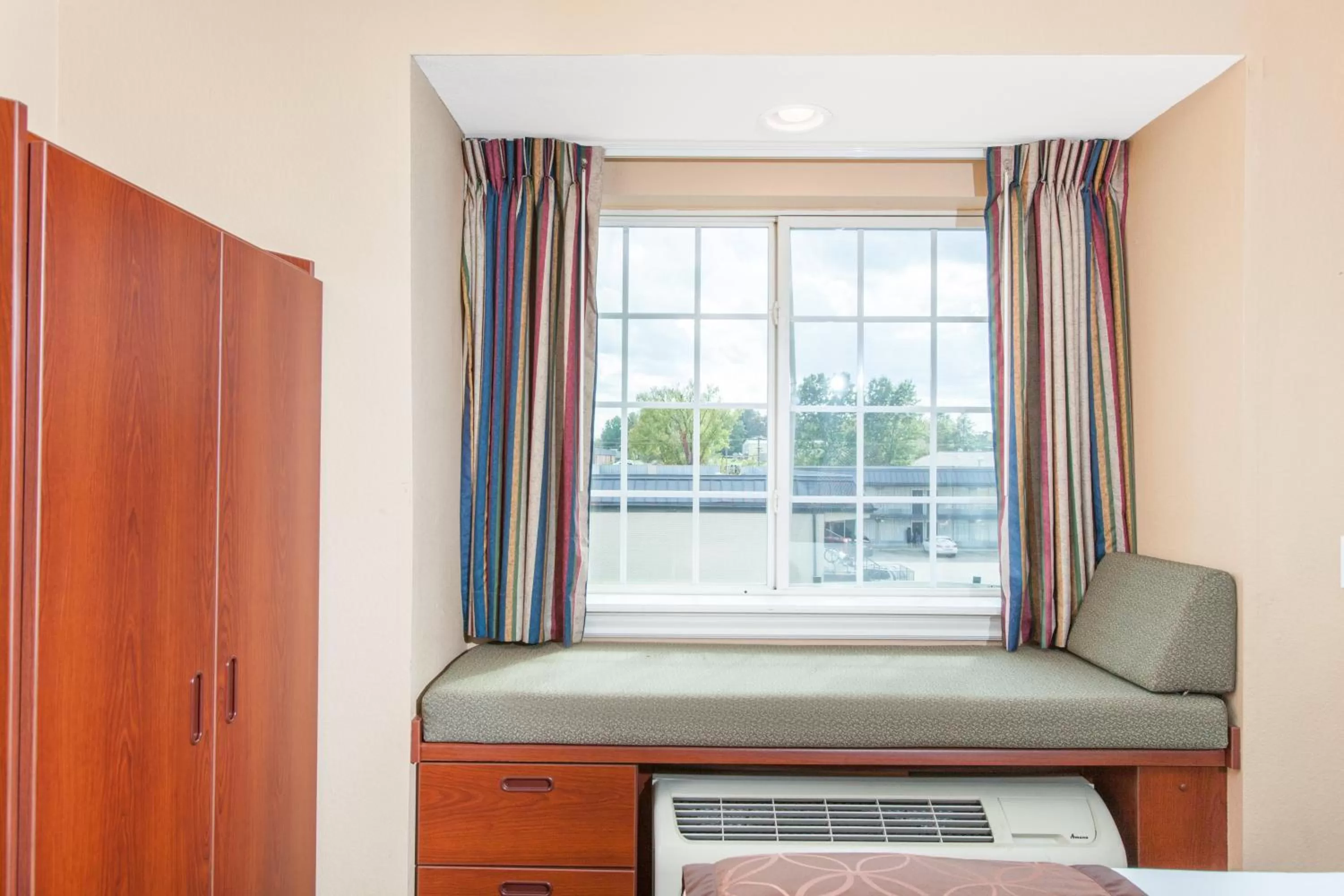 Bed in Microtel Inn by Wyndham Rogers