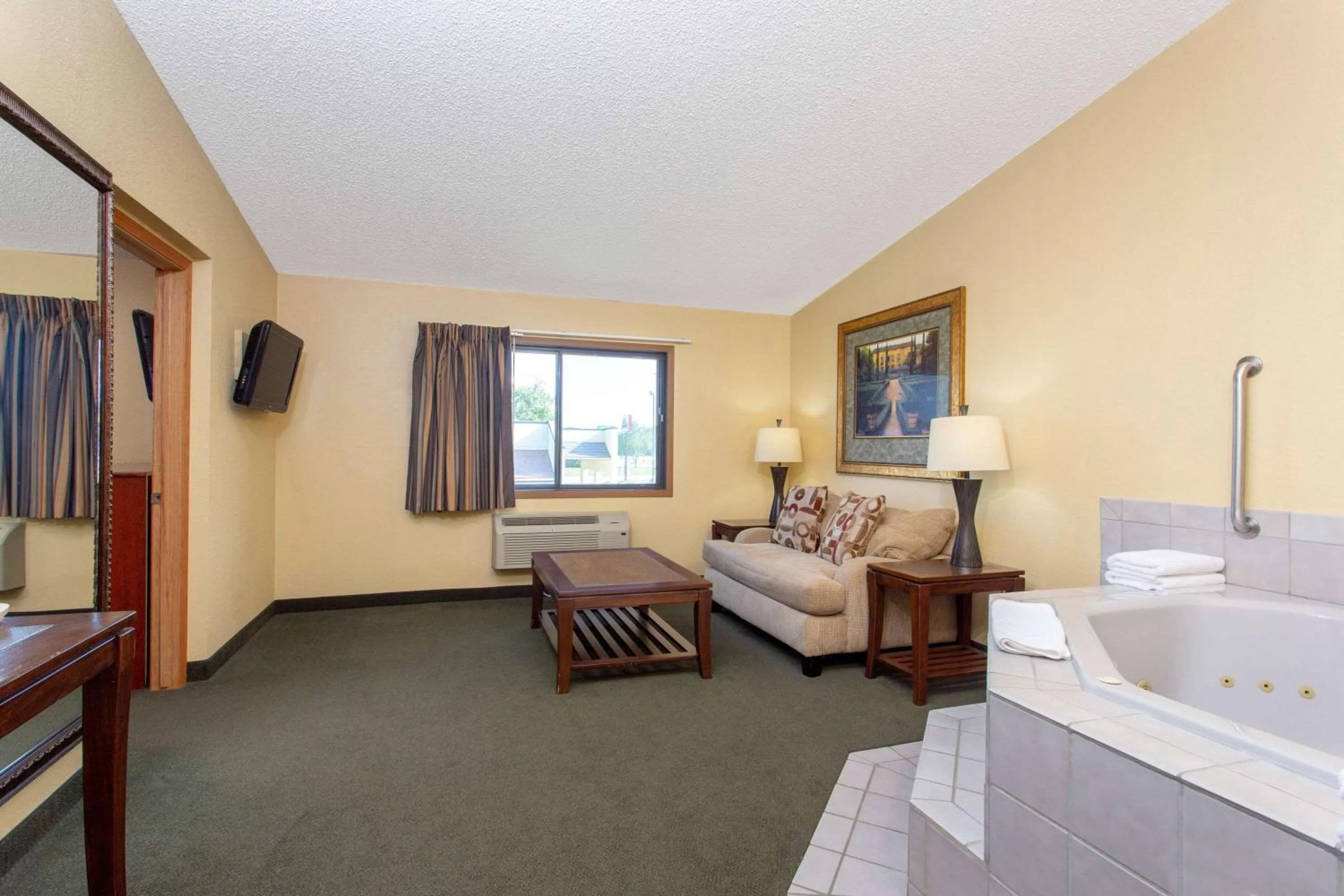 Photo of the whole room, Bed in AmericInn by Wyndham West Bend