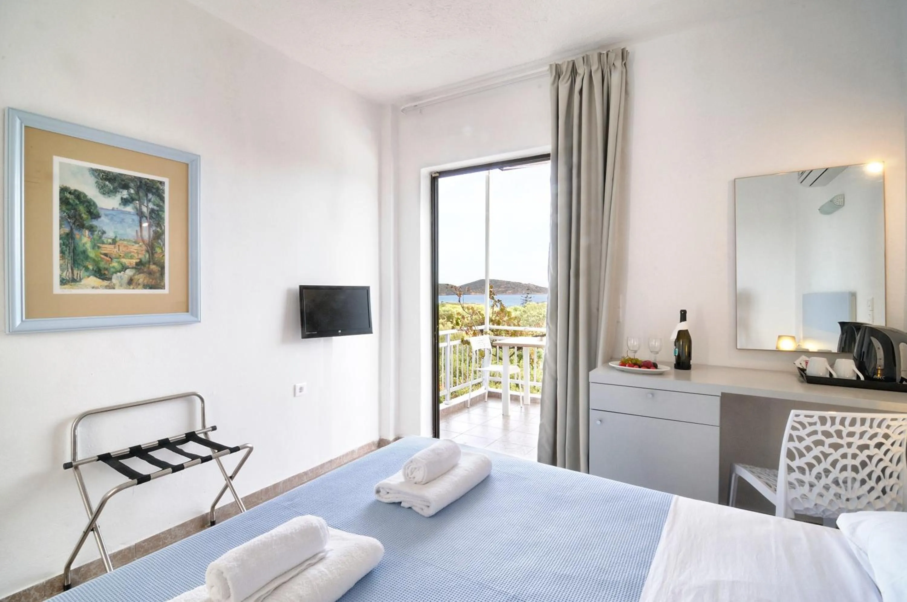 Photo of the whole room, Bed in Elounda Krini Hotel