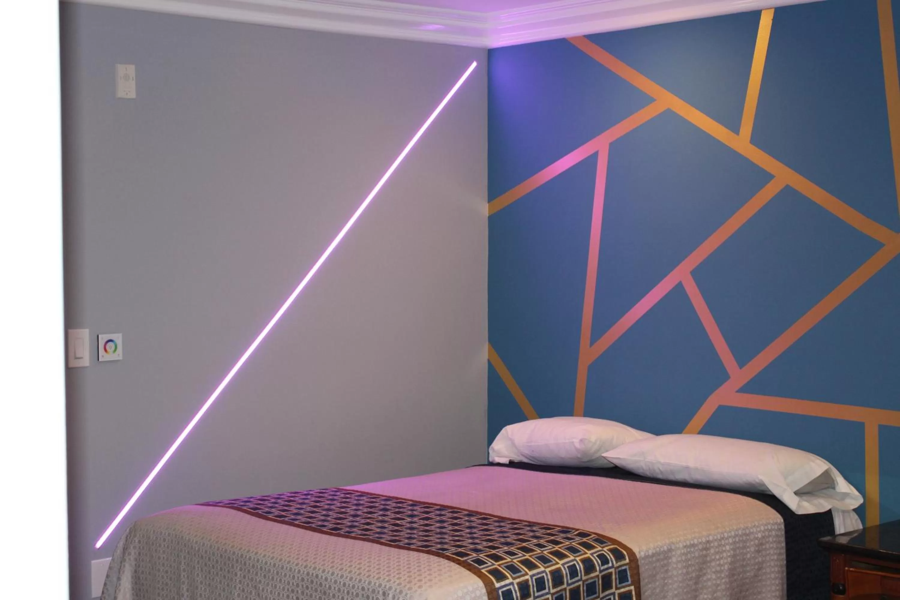 Bed in ERTH INN by AGA Maywood