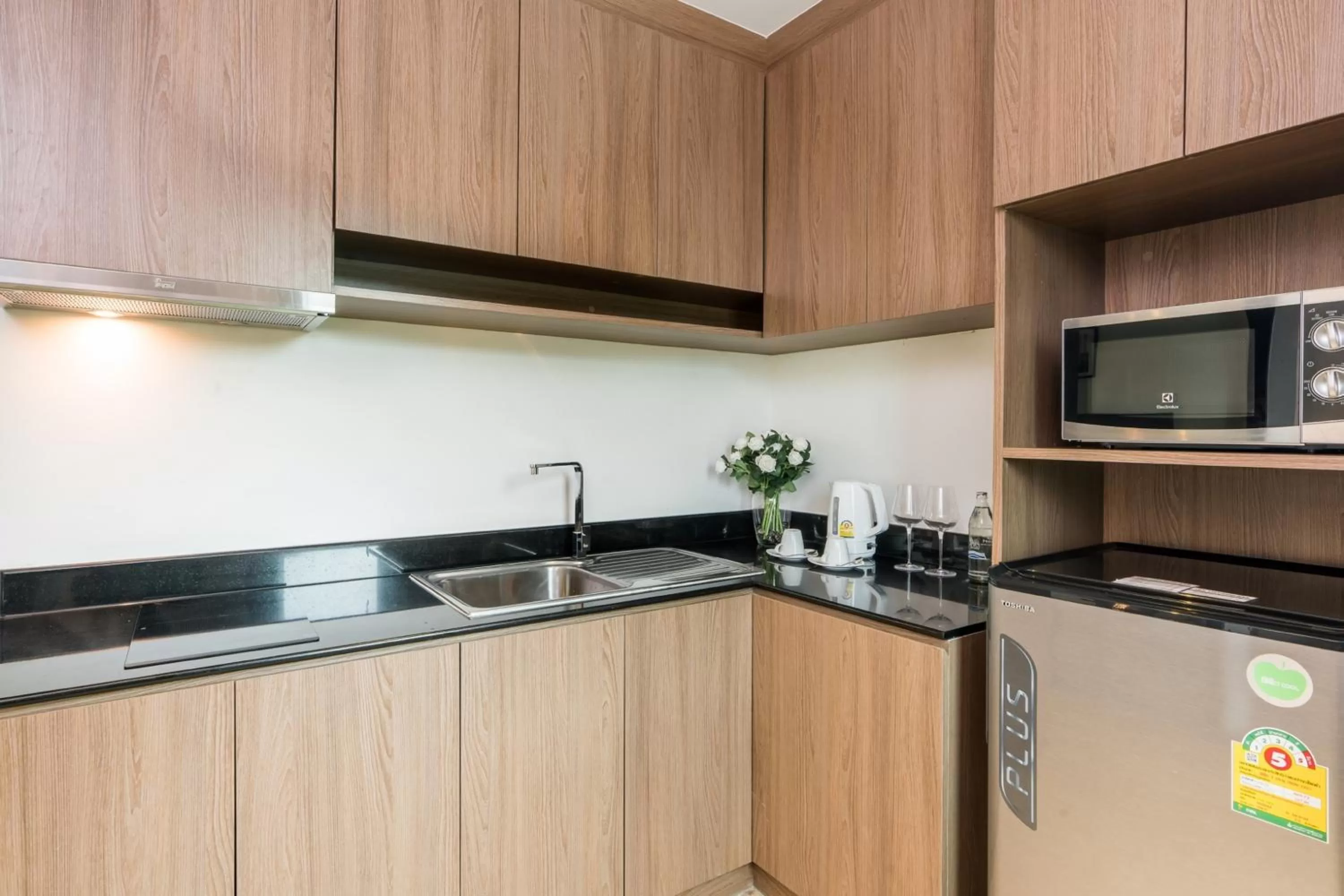 kitchen in SureStay Plus by Best Western T Pattaya