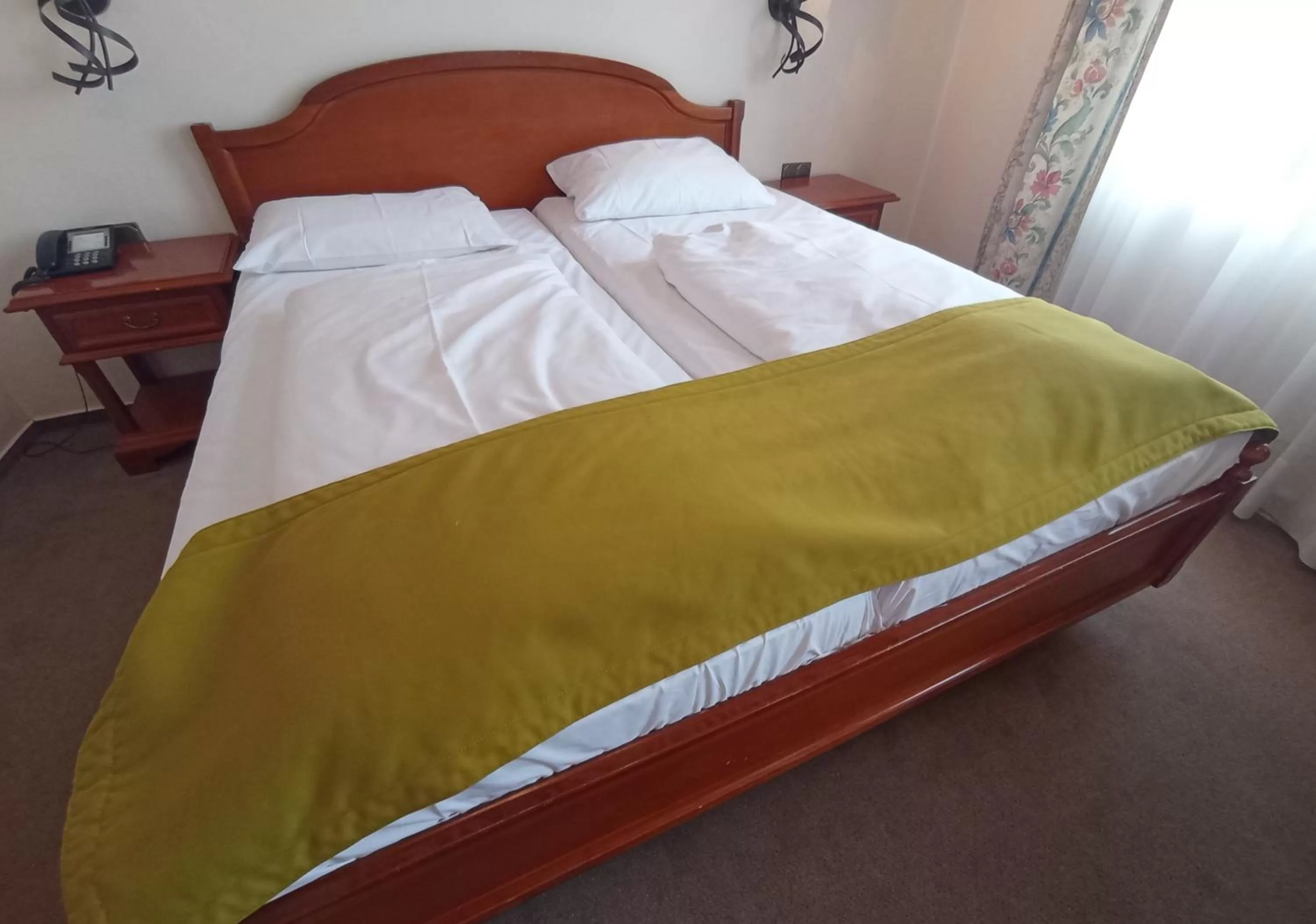 Bed in TRIP INN PostHotel Düren