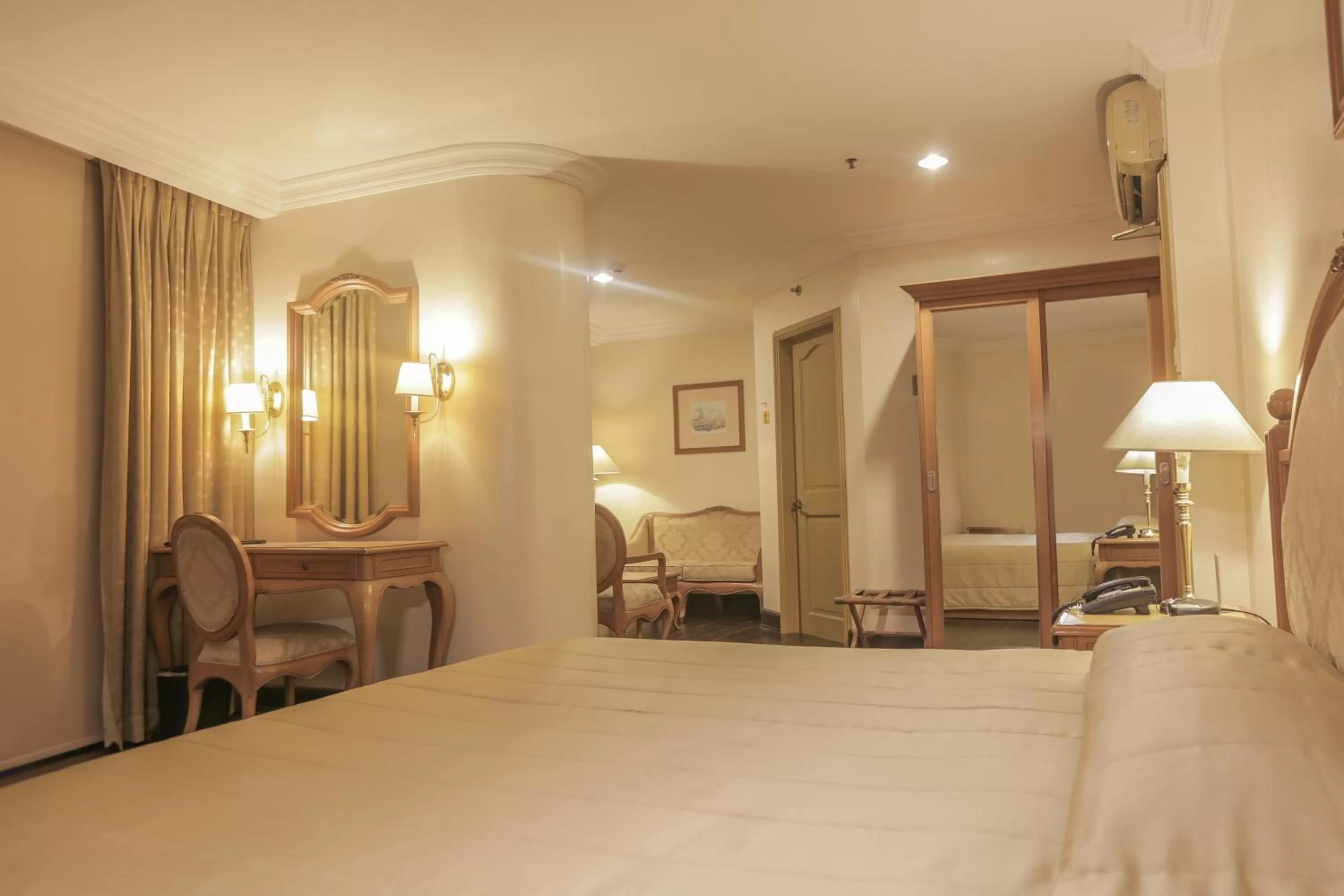 Bed in The Grand Dame Hotel