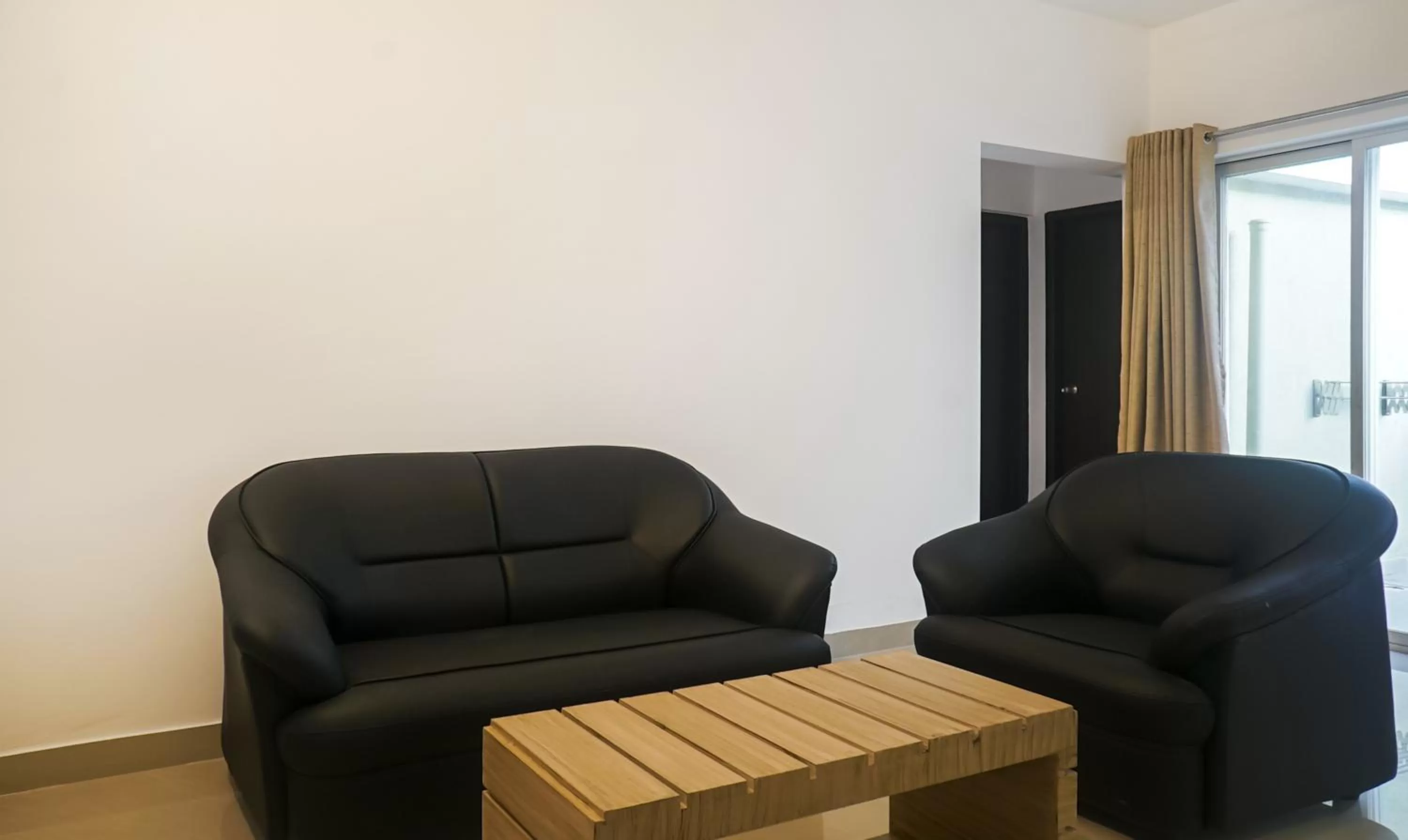Seating area in Treebo Luxe Suite, Shivaji Nagar