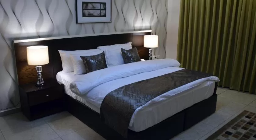Bed in City Rose Hotel Suites
