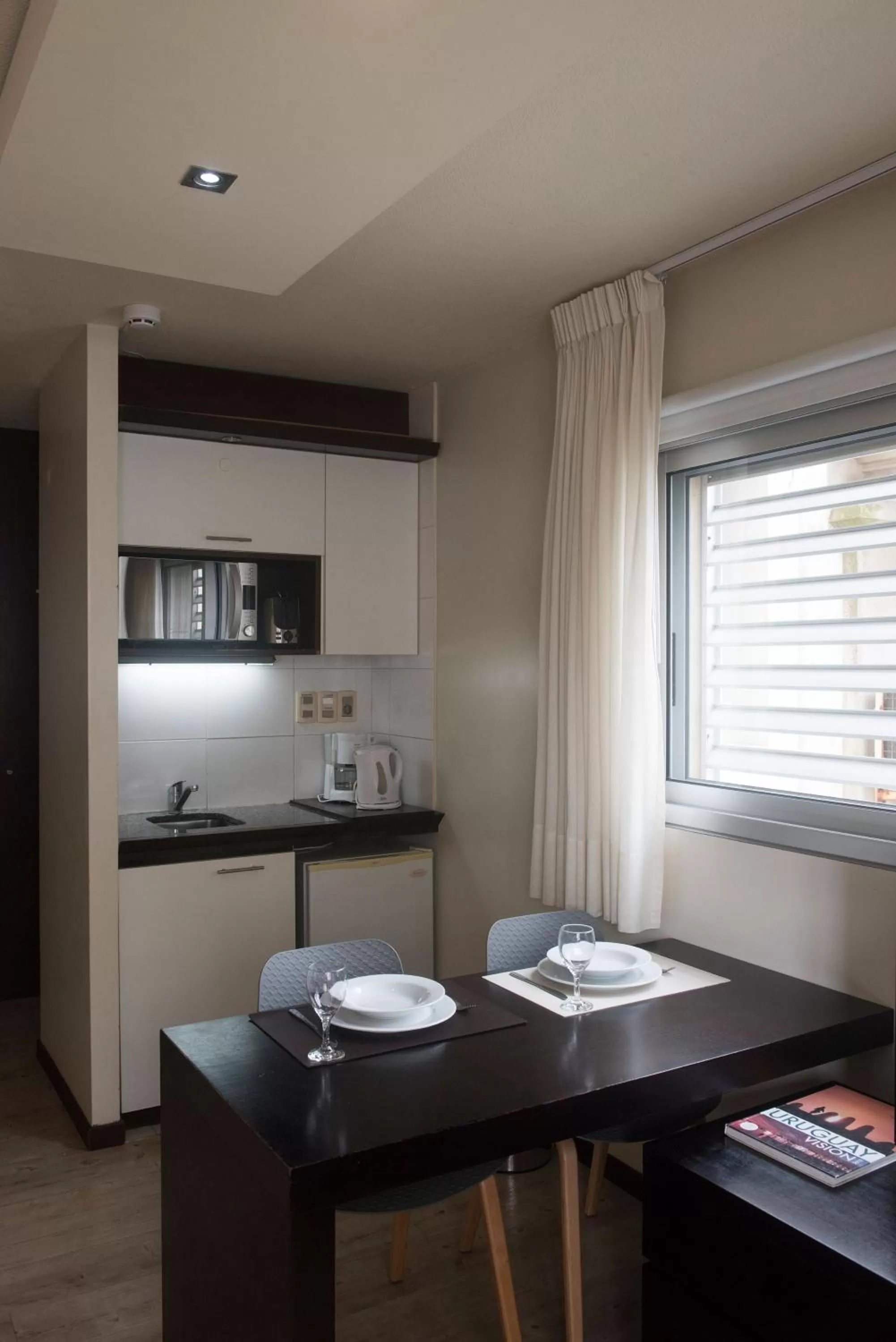 Kitchen or kitchenette in 27 Suites Hotel