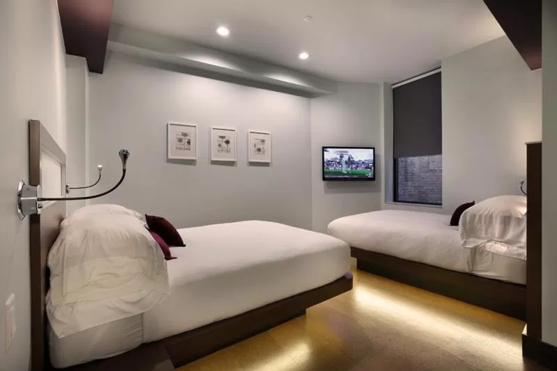 Bed in CityFlatsHotel - Grand Rapids, an Ascend Collection Hotel