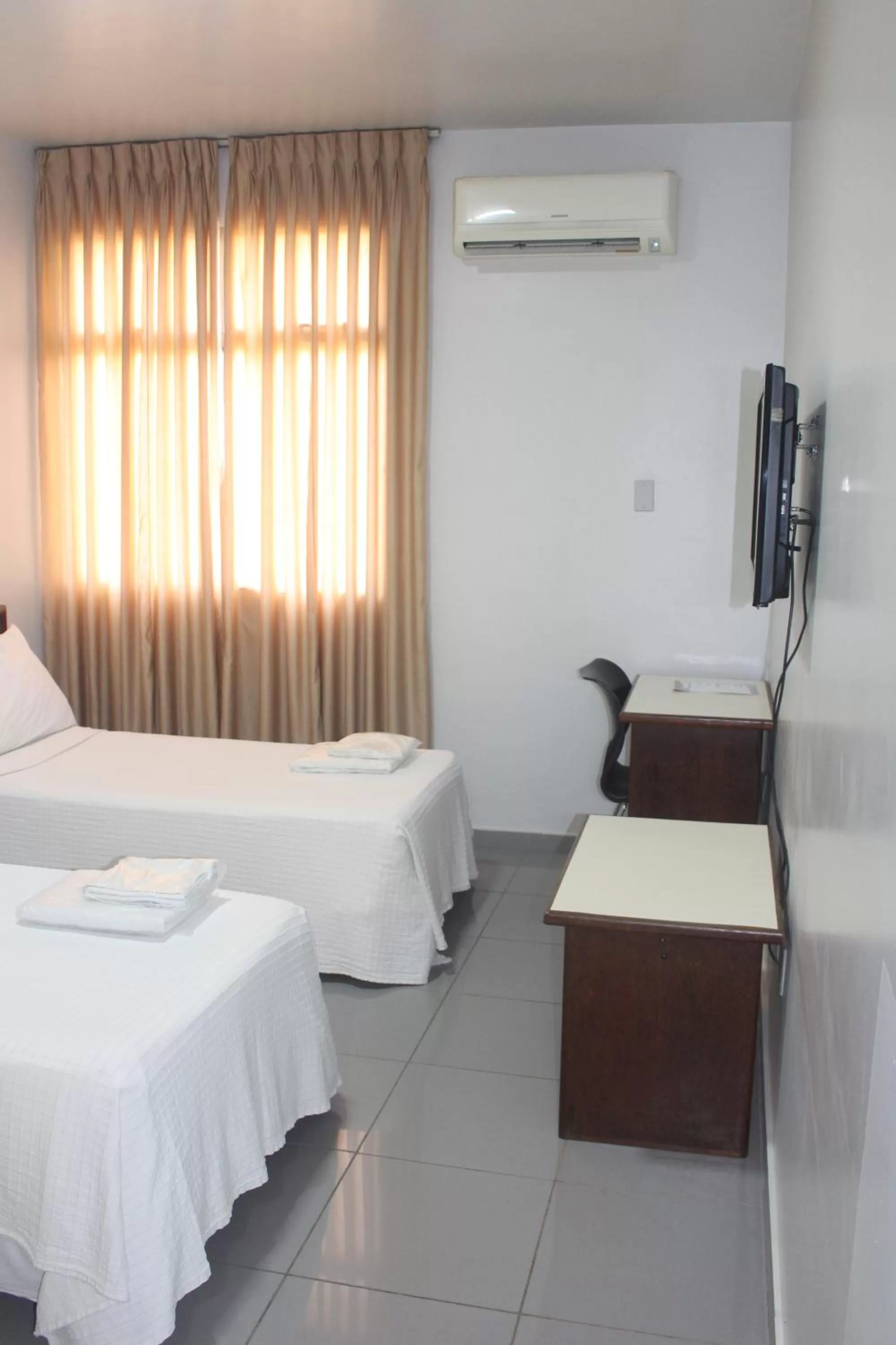 Bed in Hotel Oscar Econômico