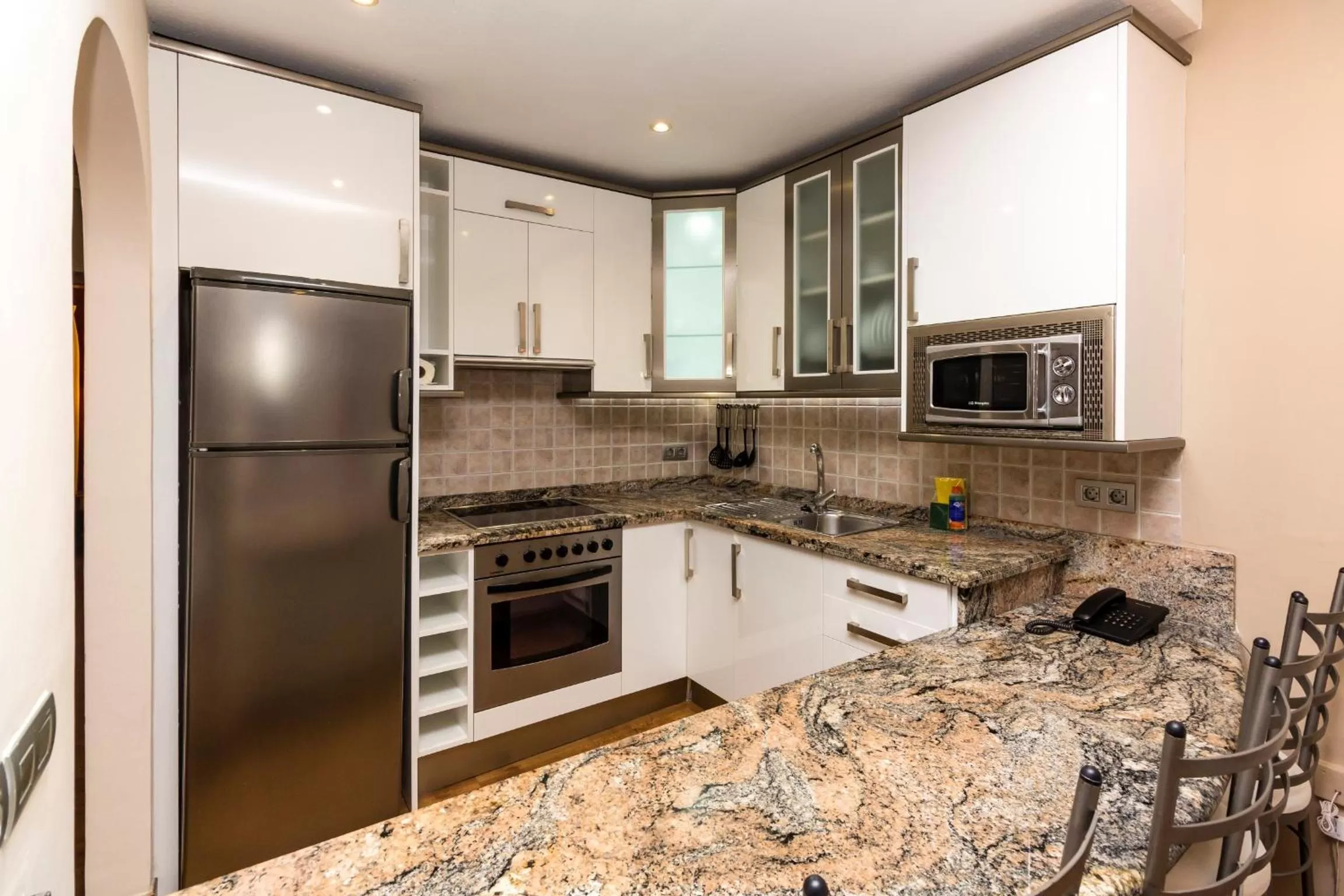 Kitchen or kitchenette in Regency Torviscas Apartments and Suites