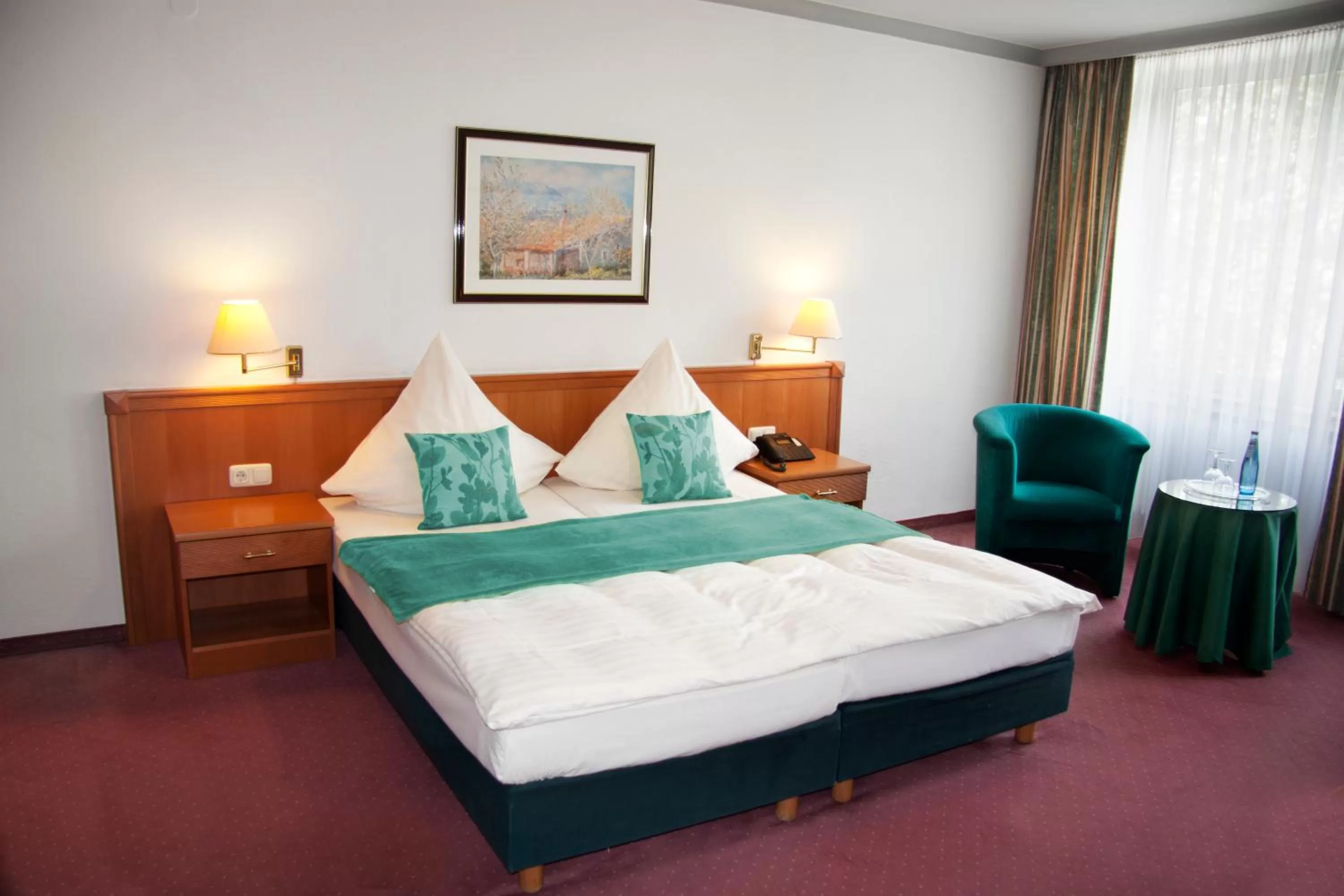 Bed in INA Hotel Royal