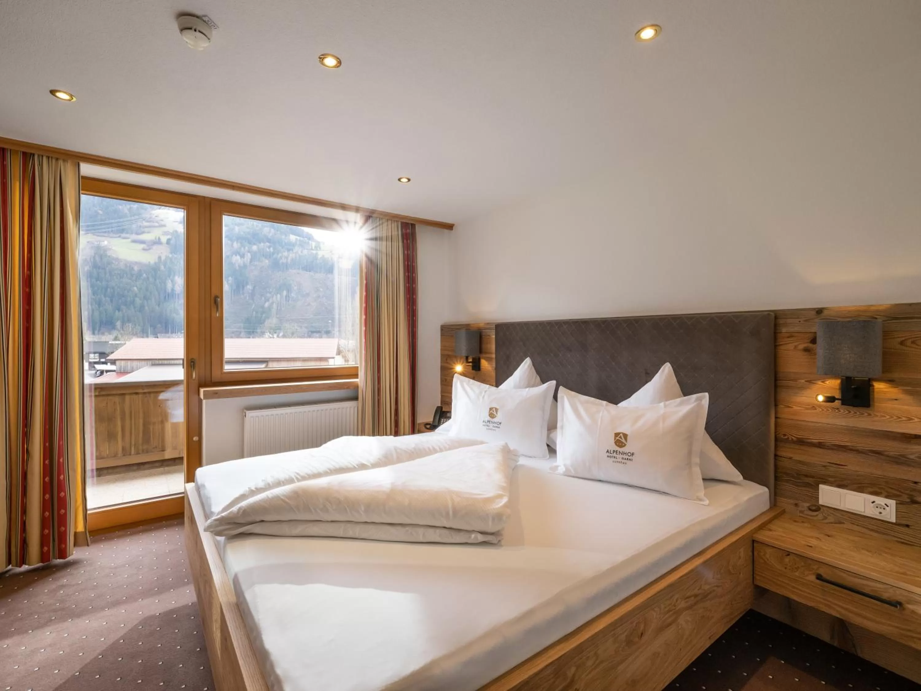 Bed in Alpenhof Hotel Garni Suprême