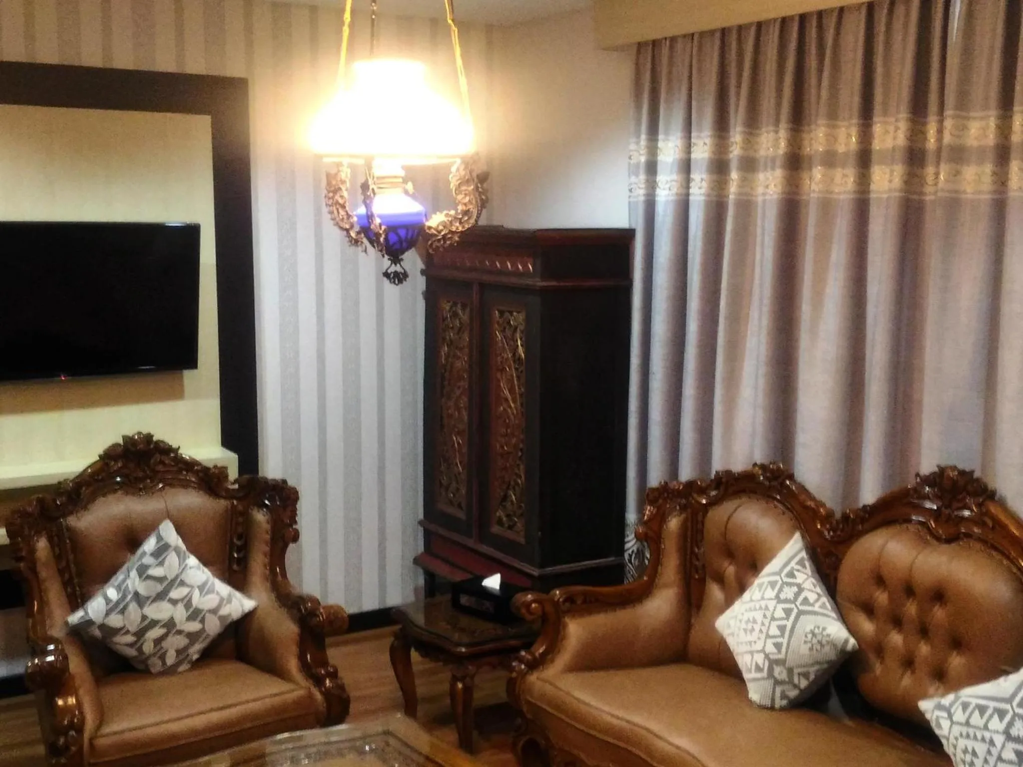 Living room in Grand Puri Saron Hotel Yogyakarta