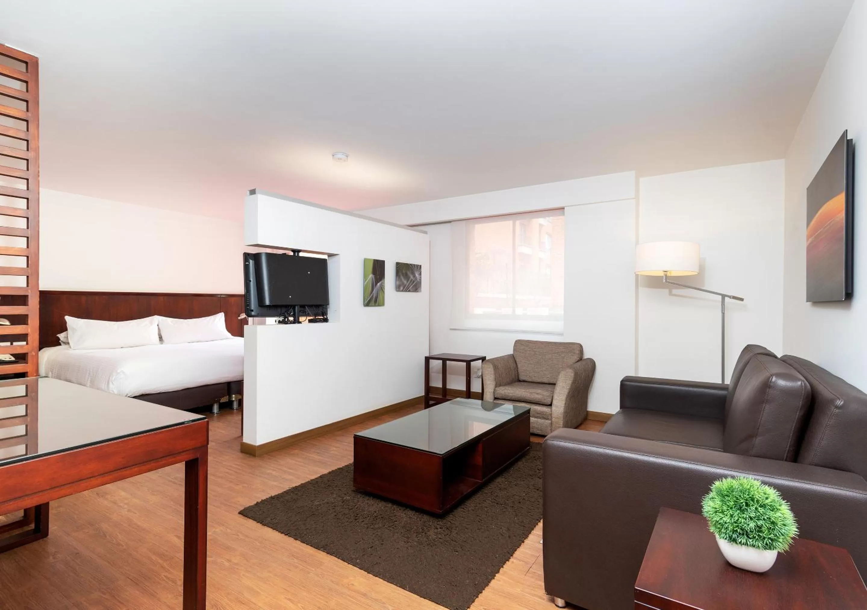 Bedroom, Seating Area in GIO Suites Parque 93 Bogotá