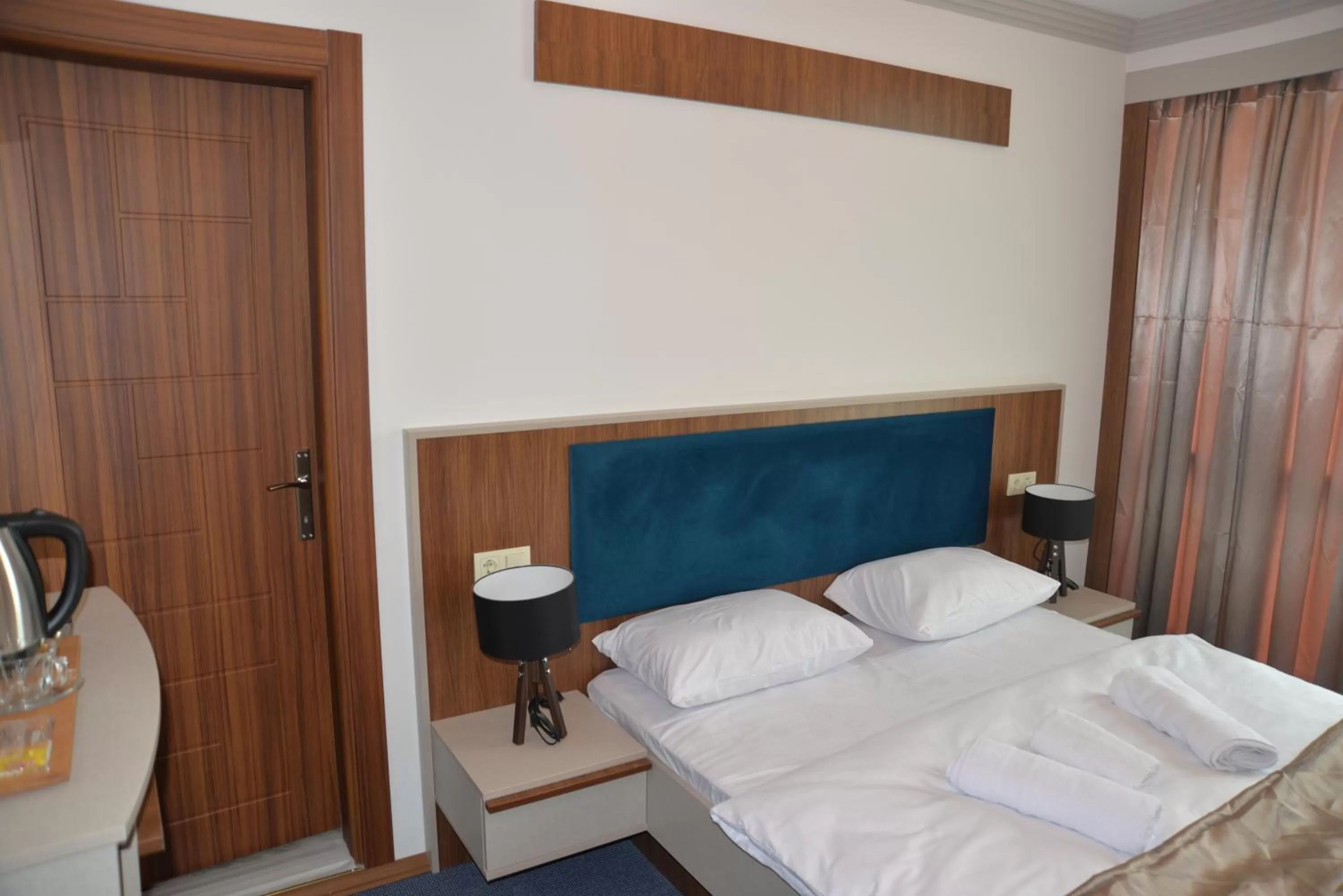 Bed in TEVETOGLU HOTEL