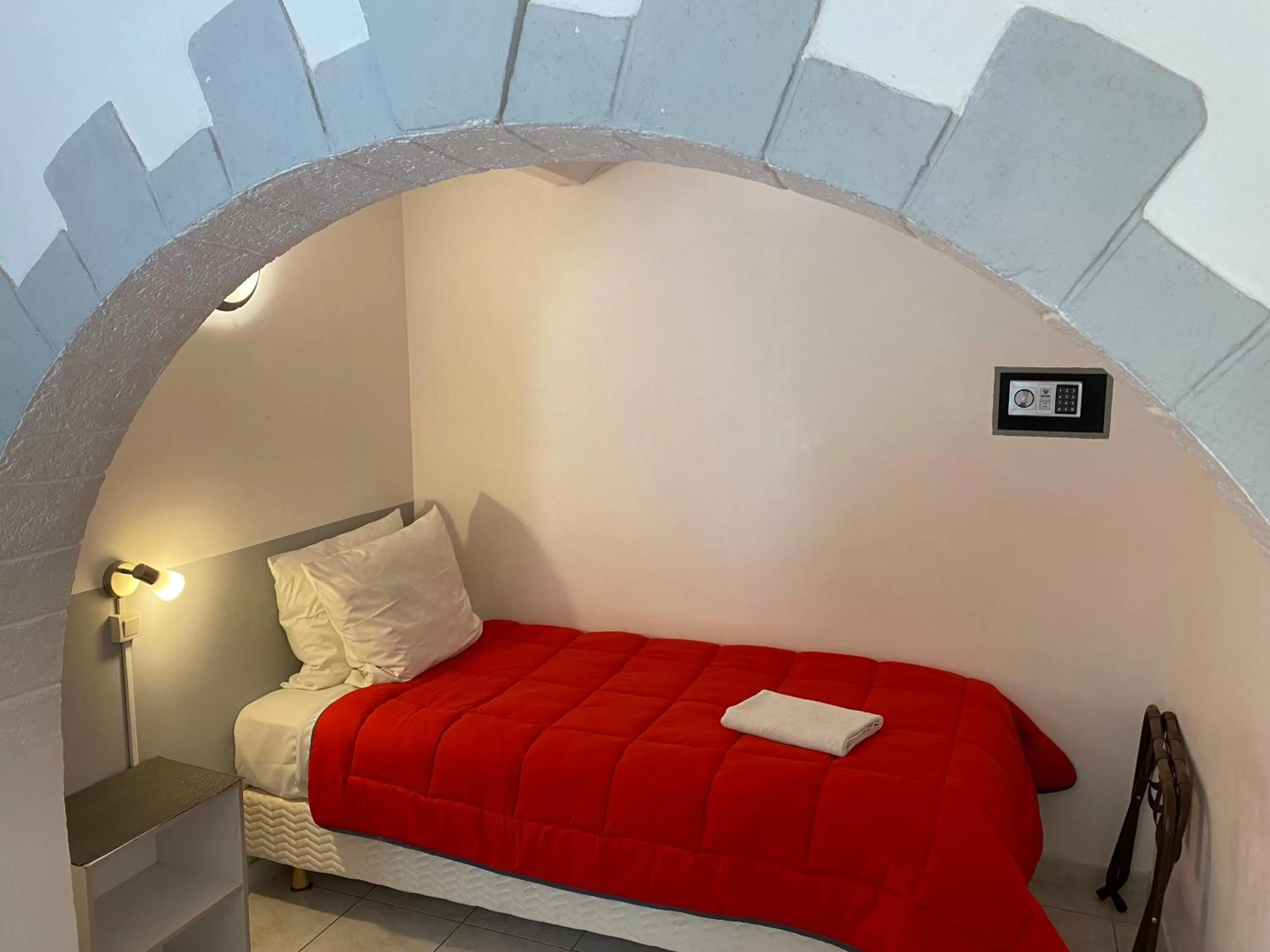 Bed in LOGIS Hôtel La Chaumière