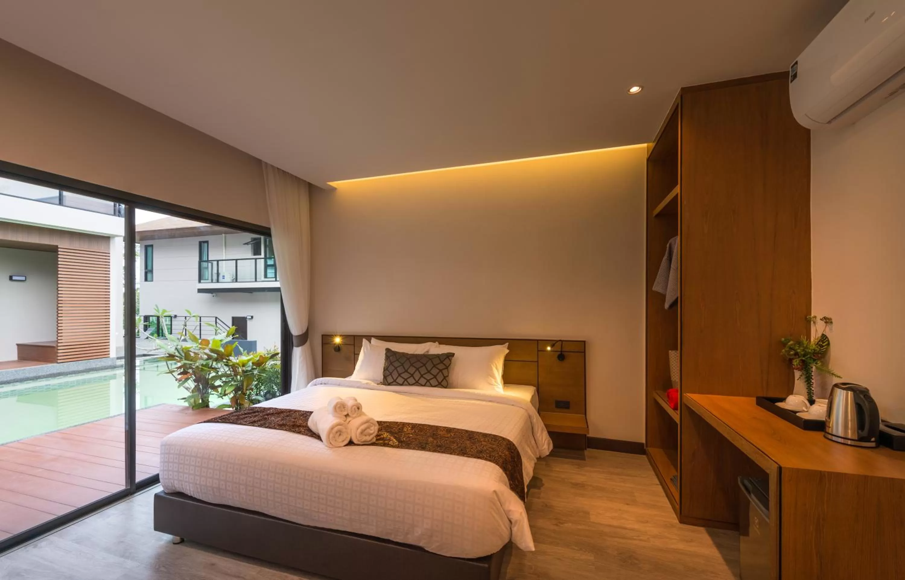 Bed in Cher​mantra​ Aonang​ Resort & Pool​ Suite
