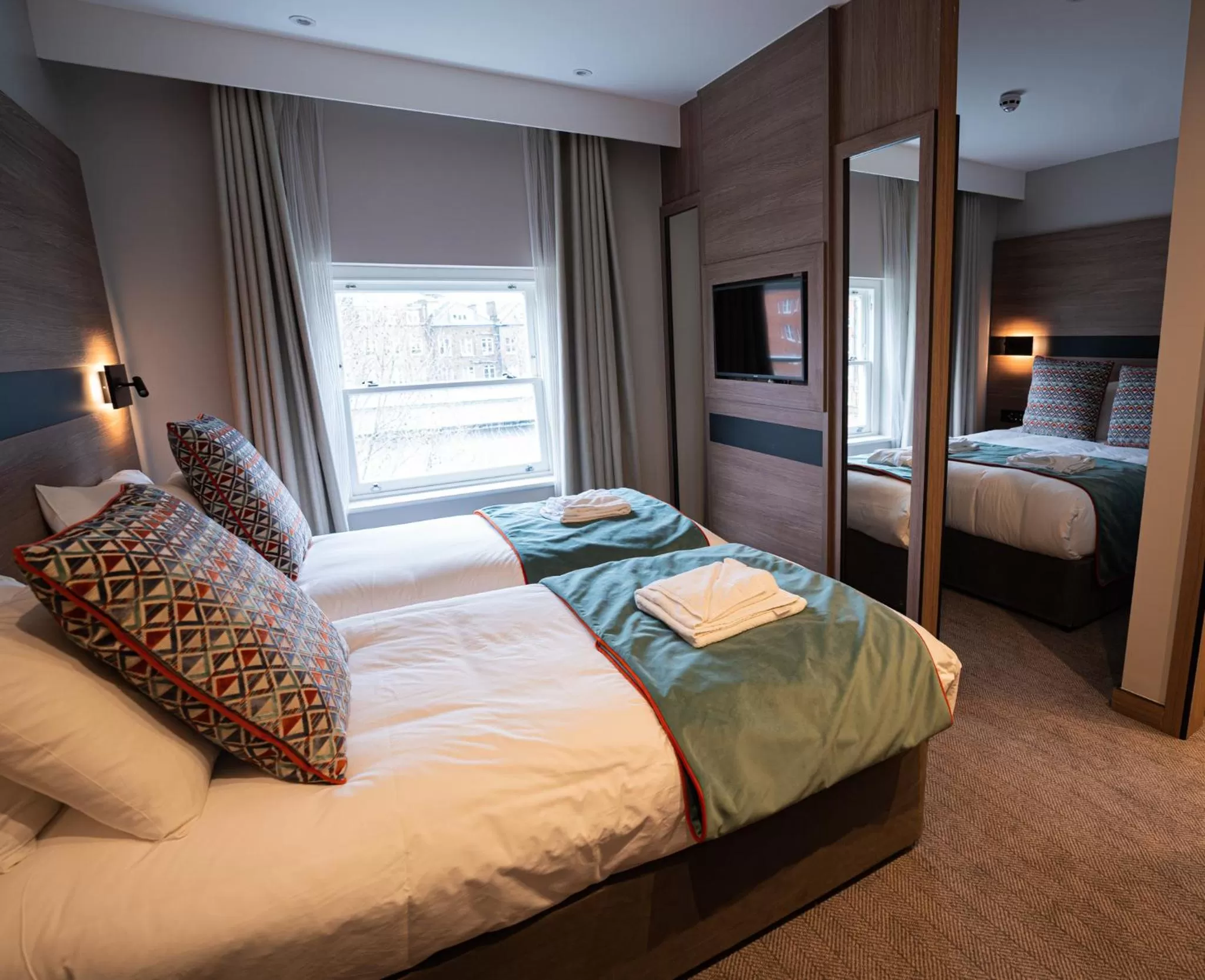 Bed in Merit Kensington Hotel