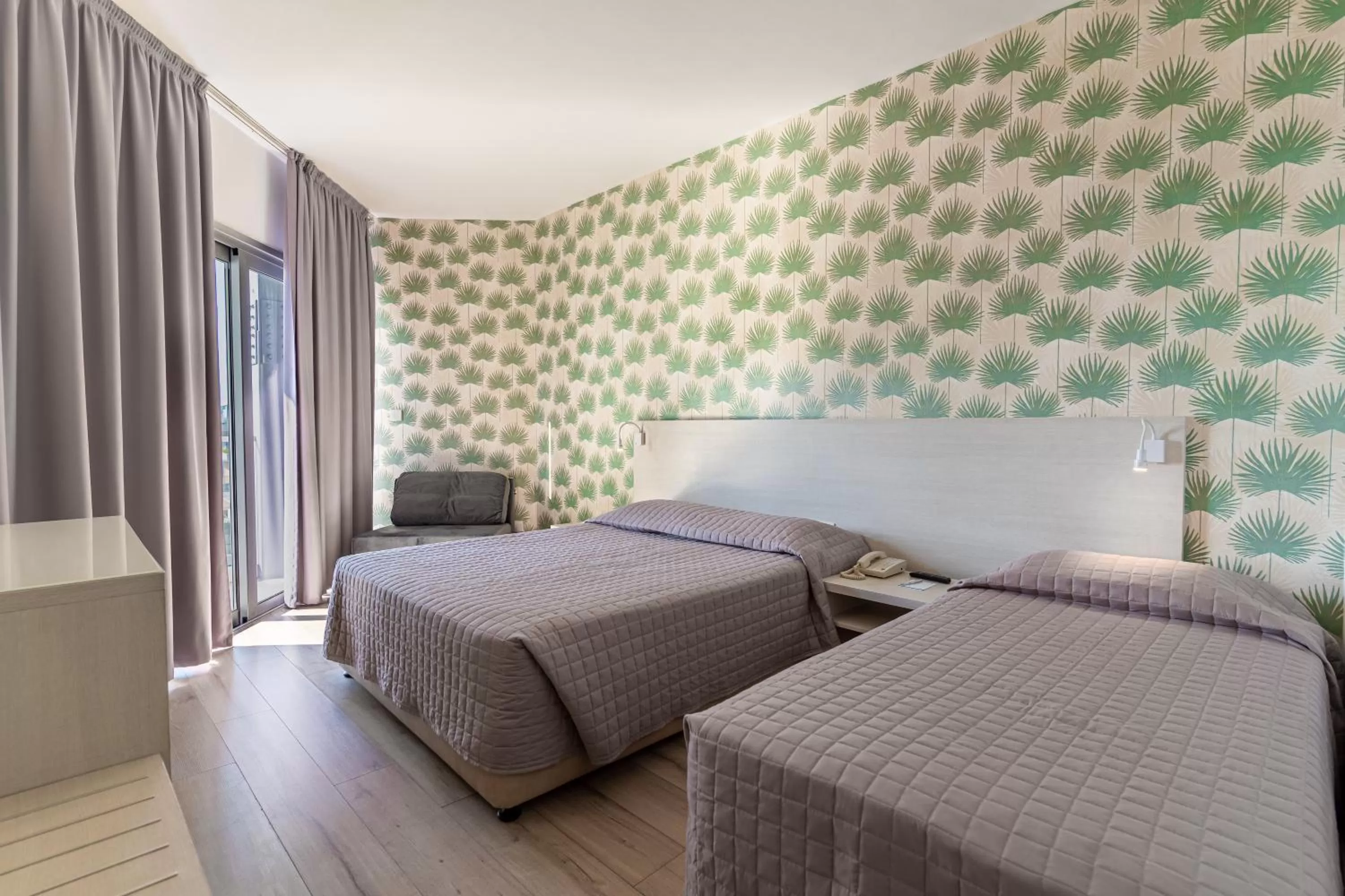 Bed in Harmony Bay Hotel