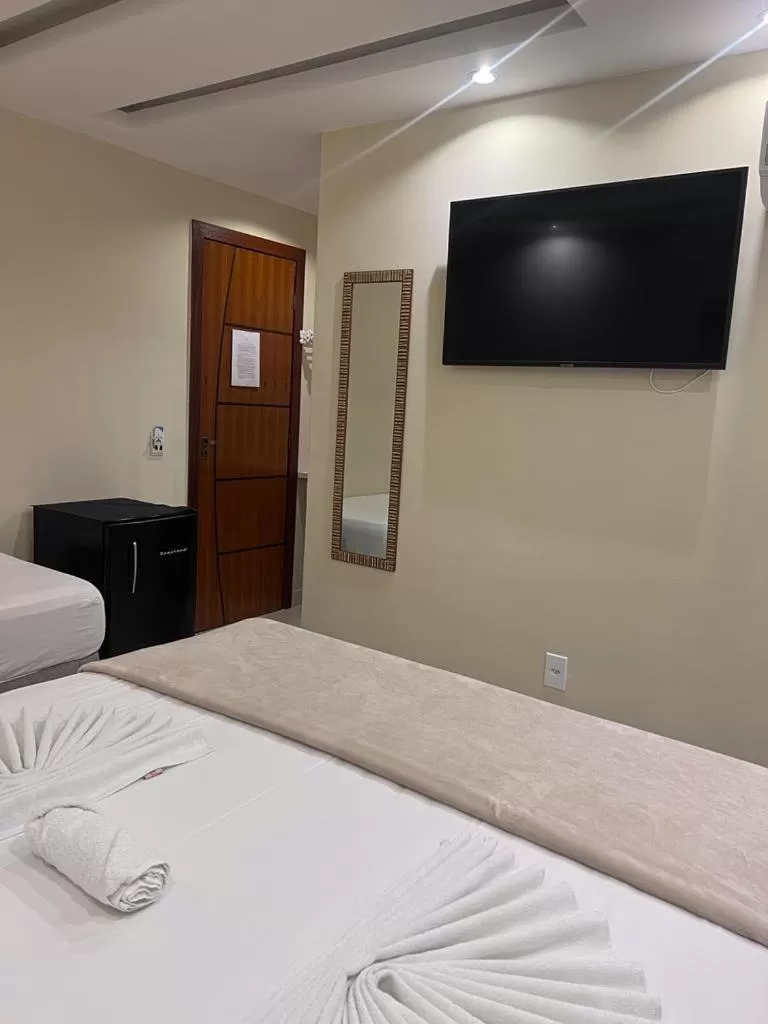 Bed in Pousada Arraial Tropical