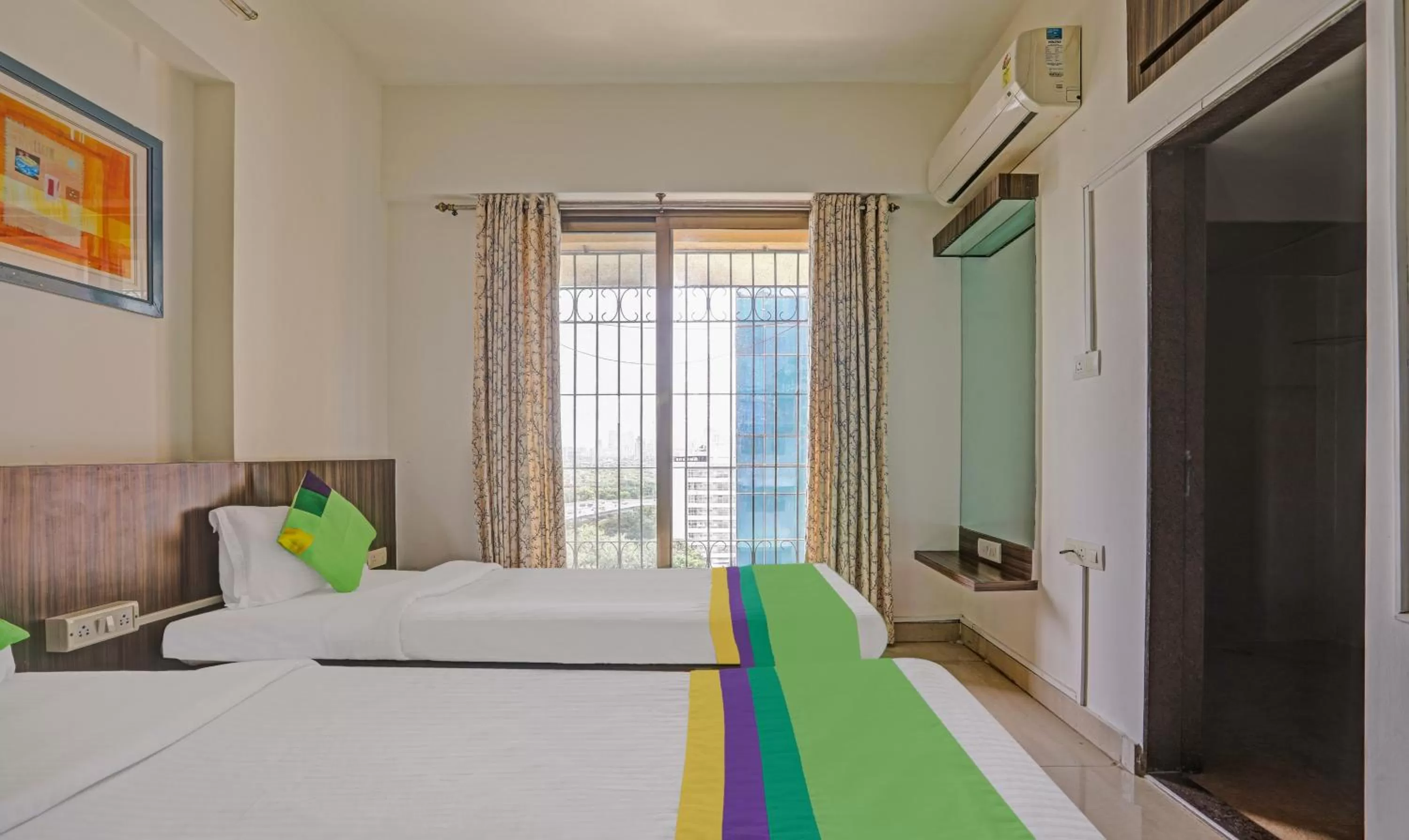 Bed in Treebo Trend Welcome Apartments