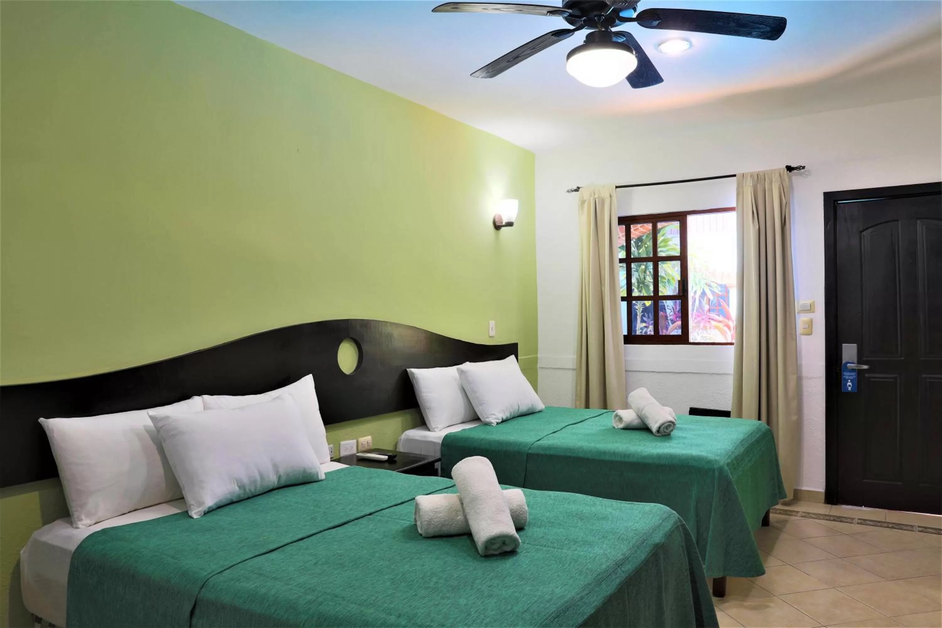 Photo of the whole room, Bed in Hotel Colonial Playa del Carmen