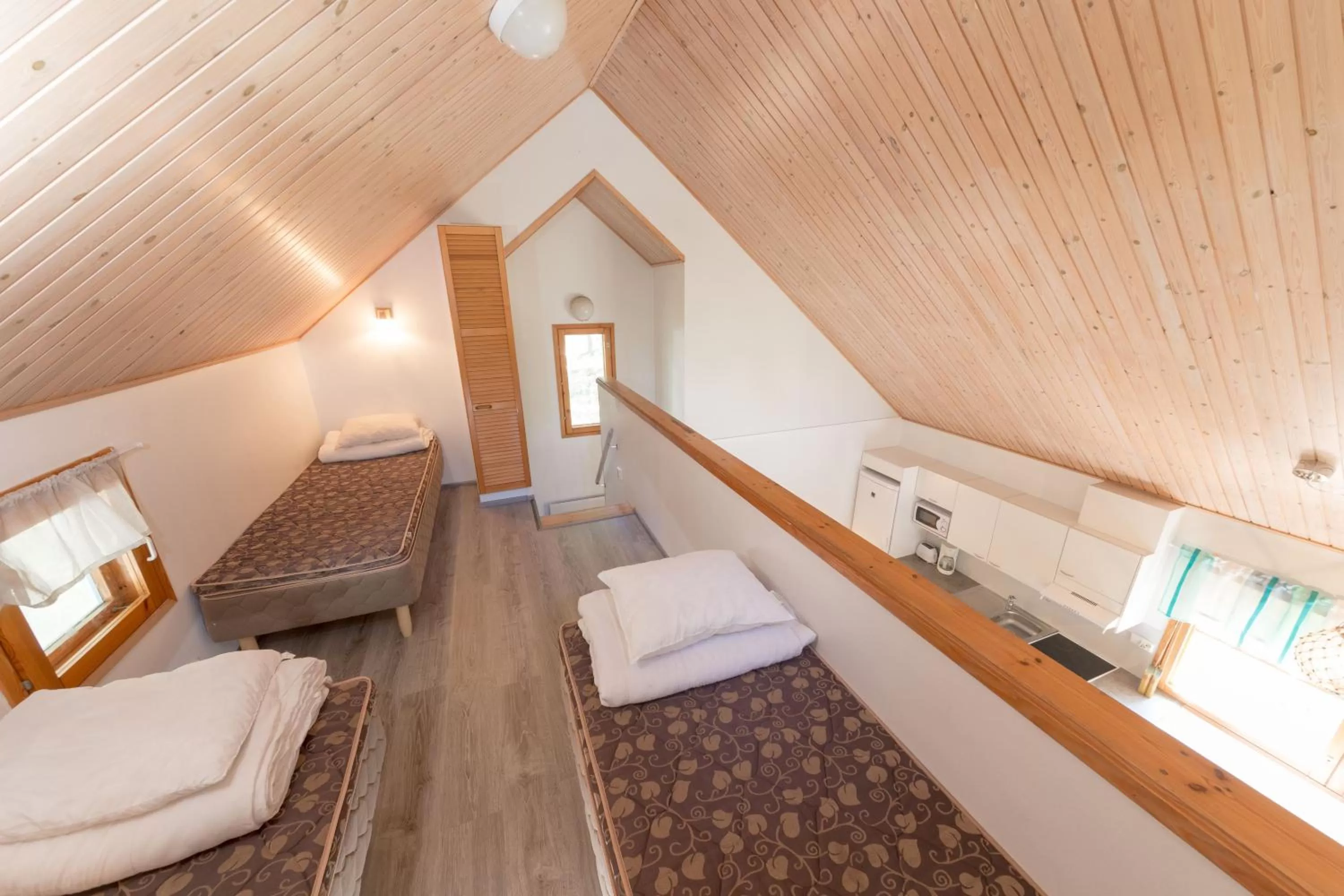 Bed in Yyteri Holiday Cottages