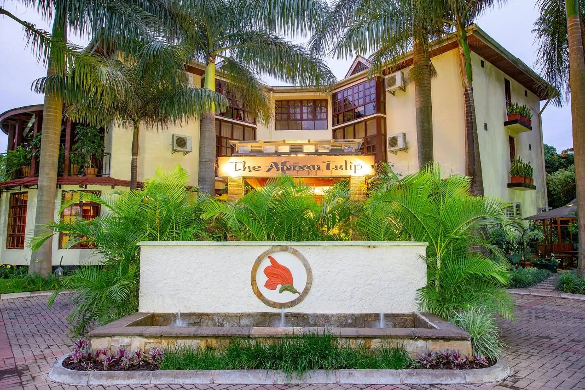 Property logo or sign in African Tulip Hotel