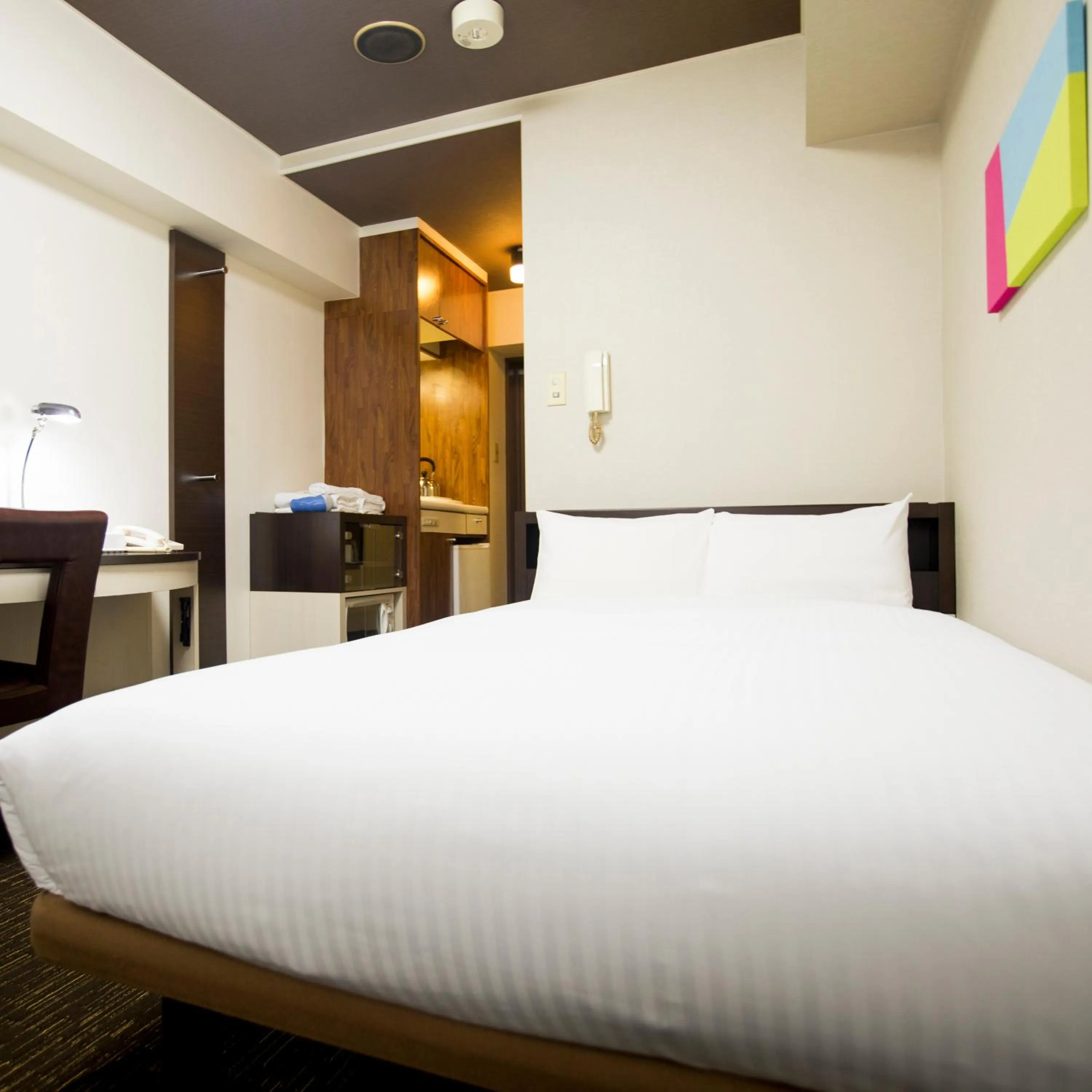 Bed in FLEXSTAY INN Kawasaki Kaizuka