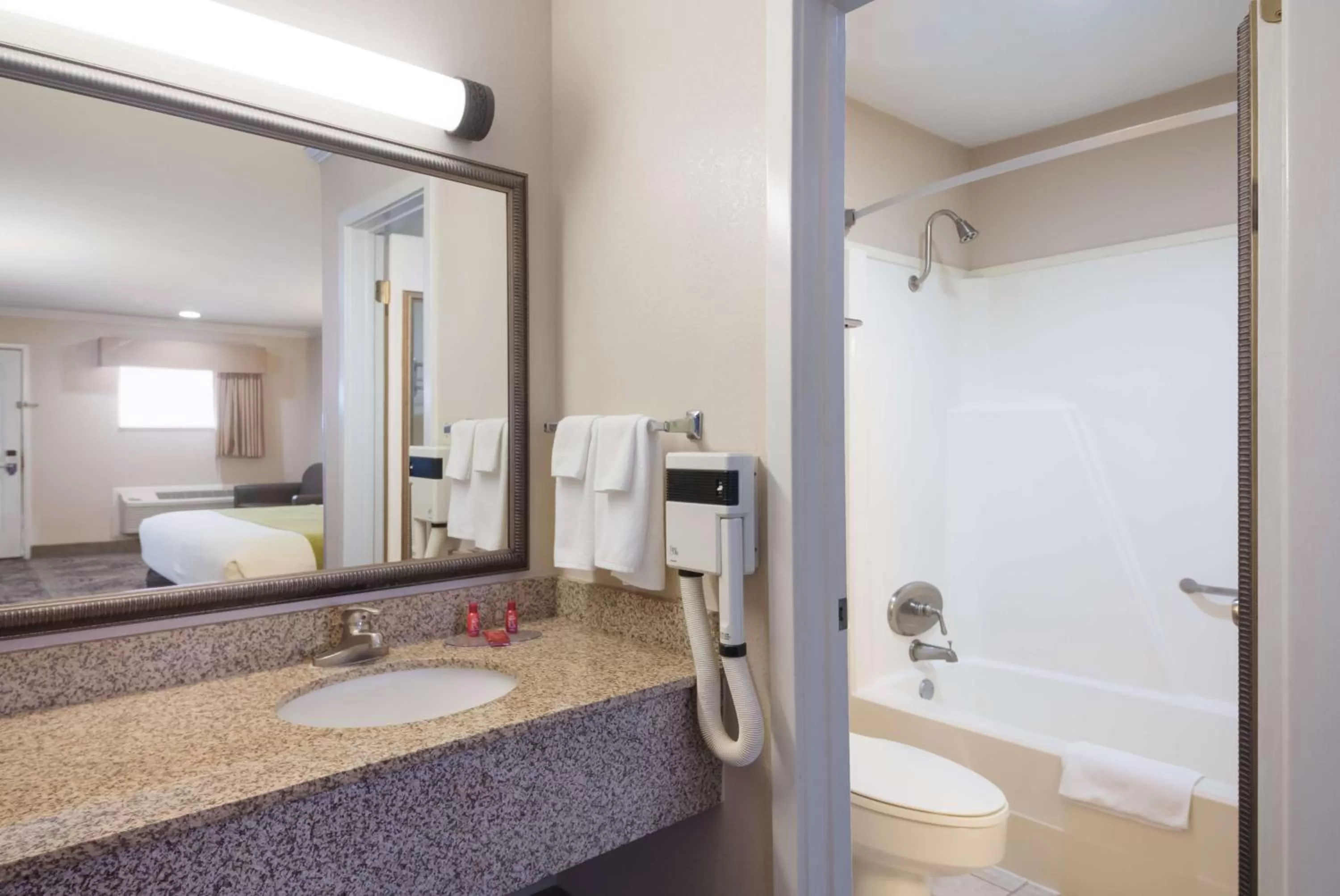Bathroom, Bed in SureStay Hotel by Best Western Rockdale