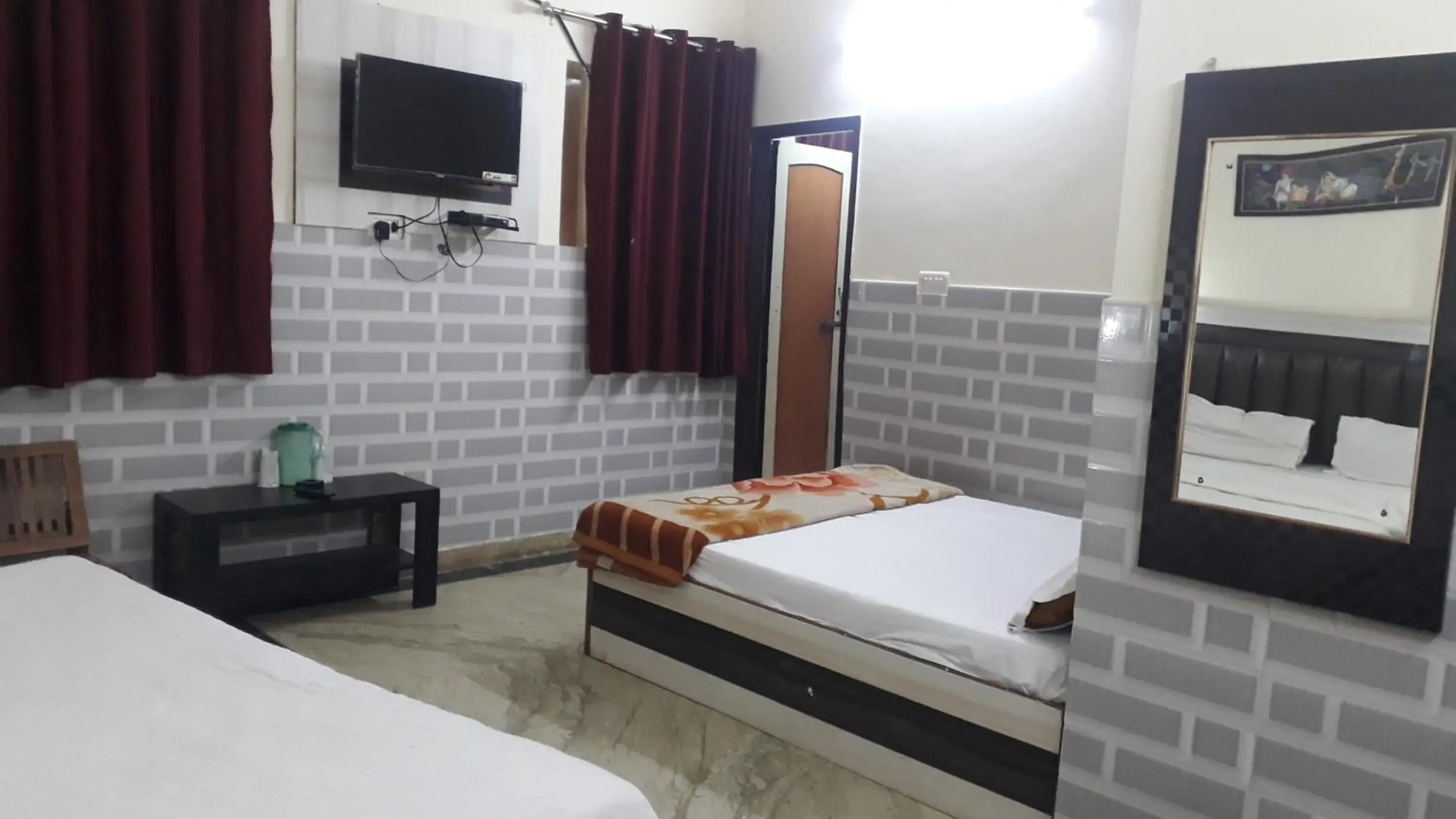 Deluxe Double Room (2 Adults + 1 Child) - single occupancy in HOTEL SARWAN Deluxe Double Room (2 Adults + 1 Child) - single occupancy in HOTEL SARWAN