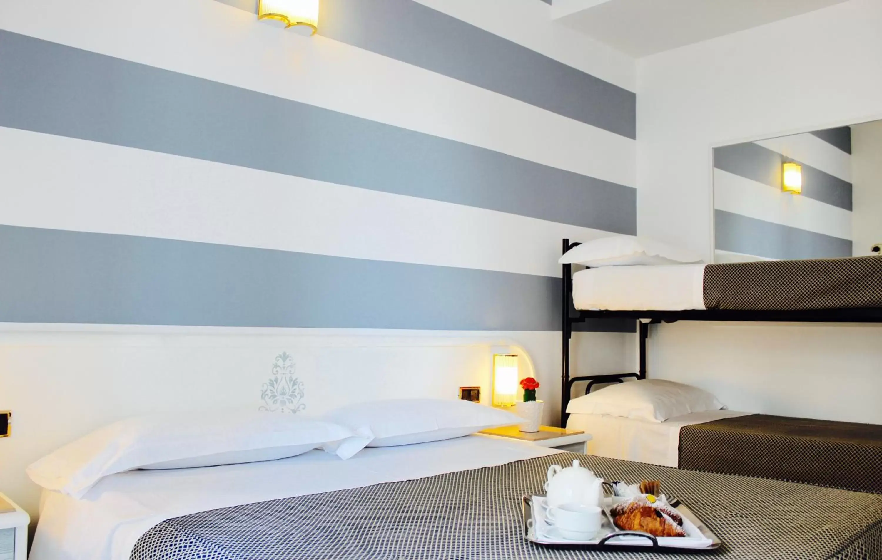 Superior Quadruple Room in Hotel Du Soleil Superior Quadruple Room in Hotel Du Soleil