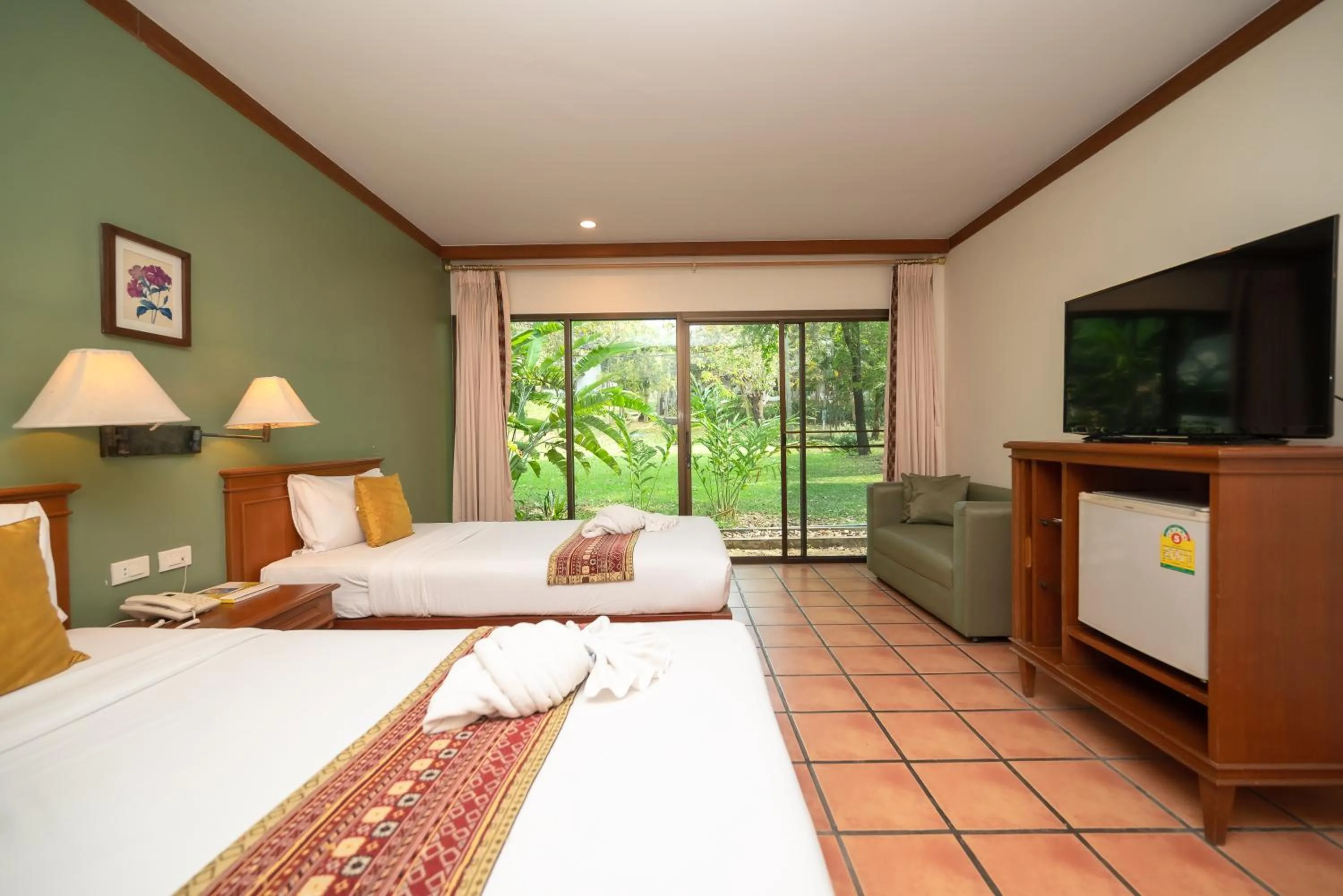Bed in Comsaed River Kwai Resort