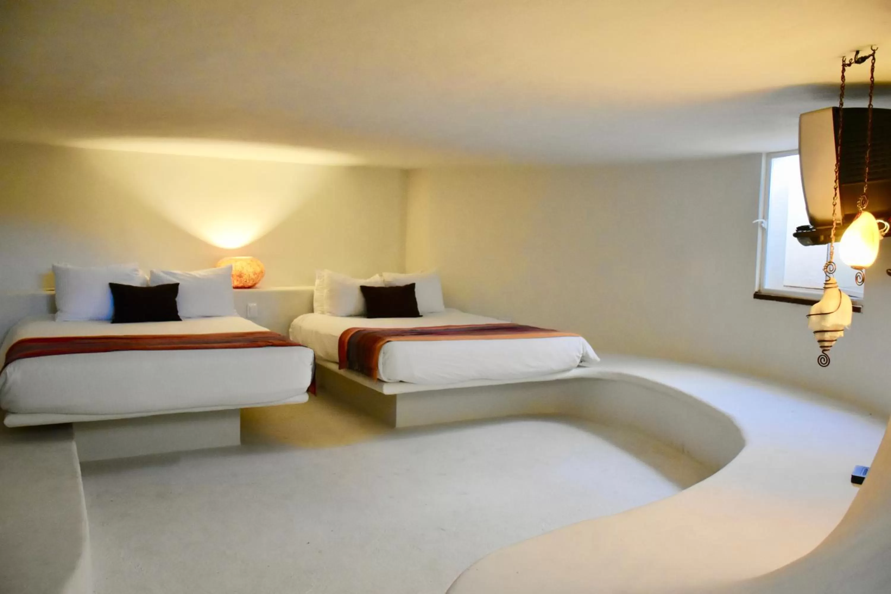 Bed in Playa Palms Beach Hotel