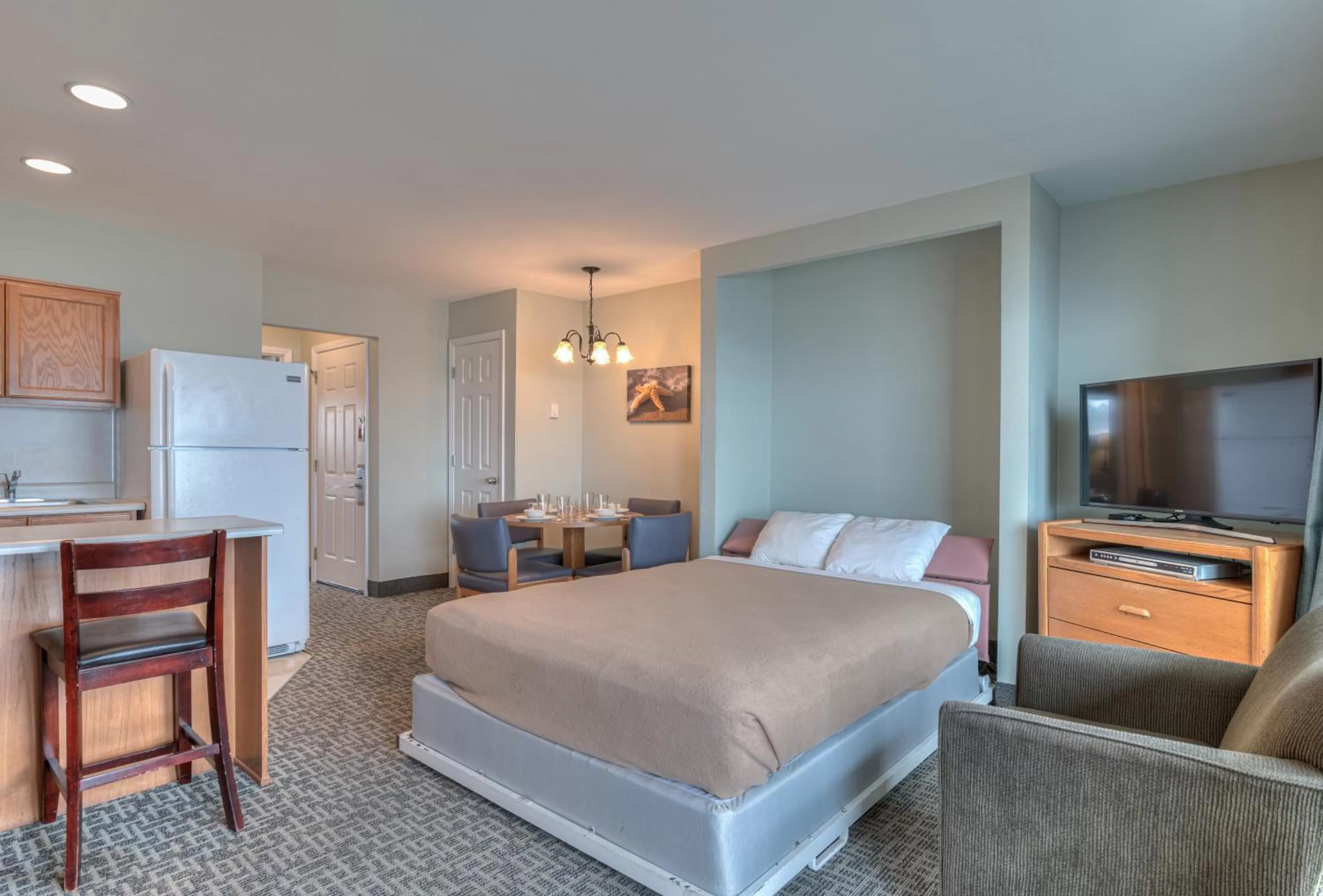 Bed, TV/Entertainment Center in D Sands Rentals