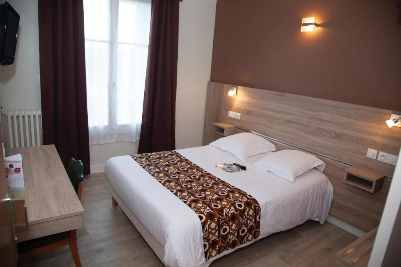 Bed in Hôtel La Pocatière