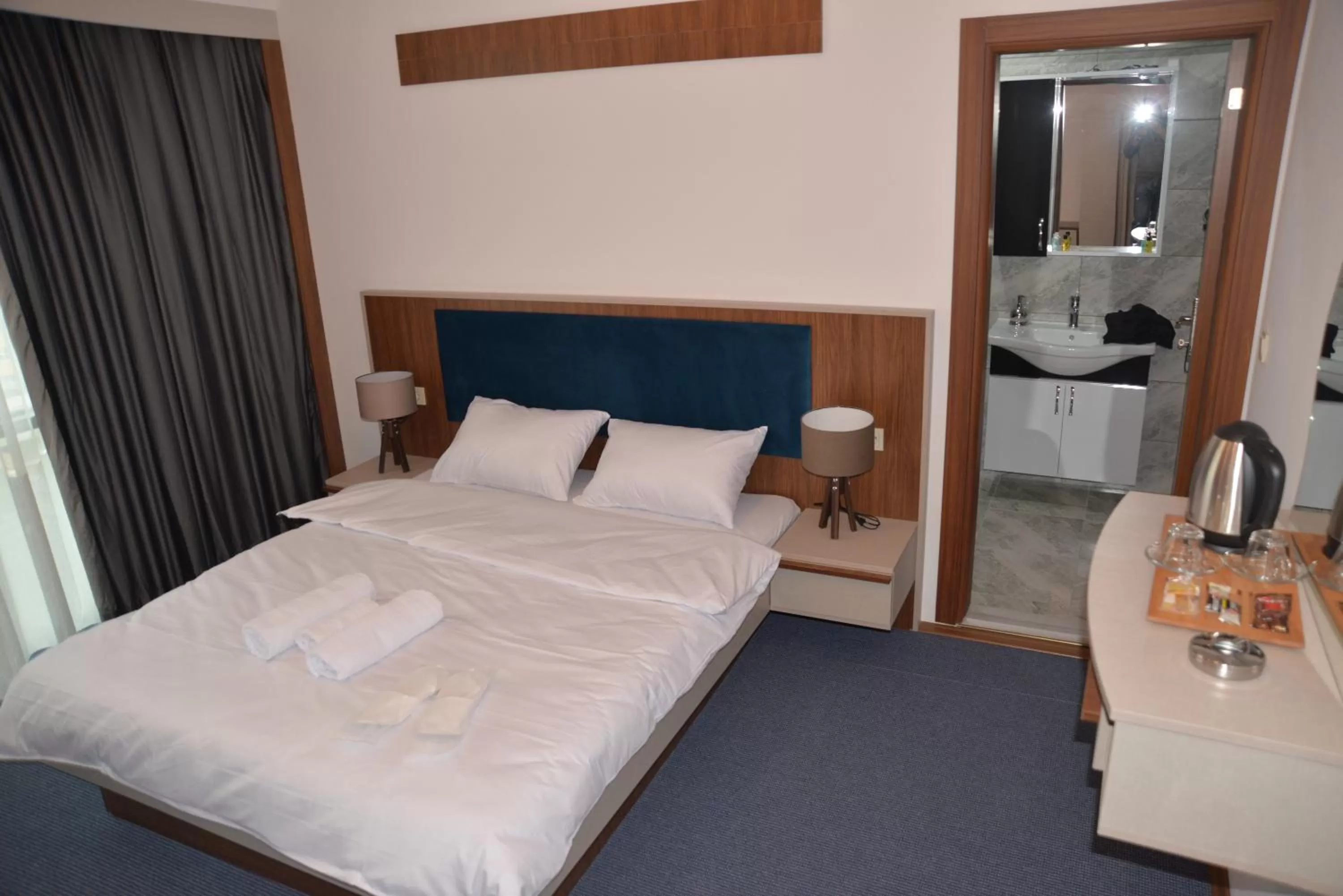 Bed in TEVETOGLU HOTEL